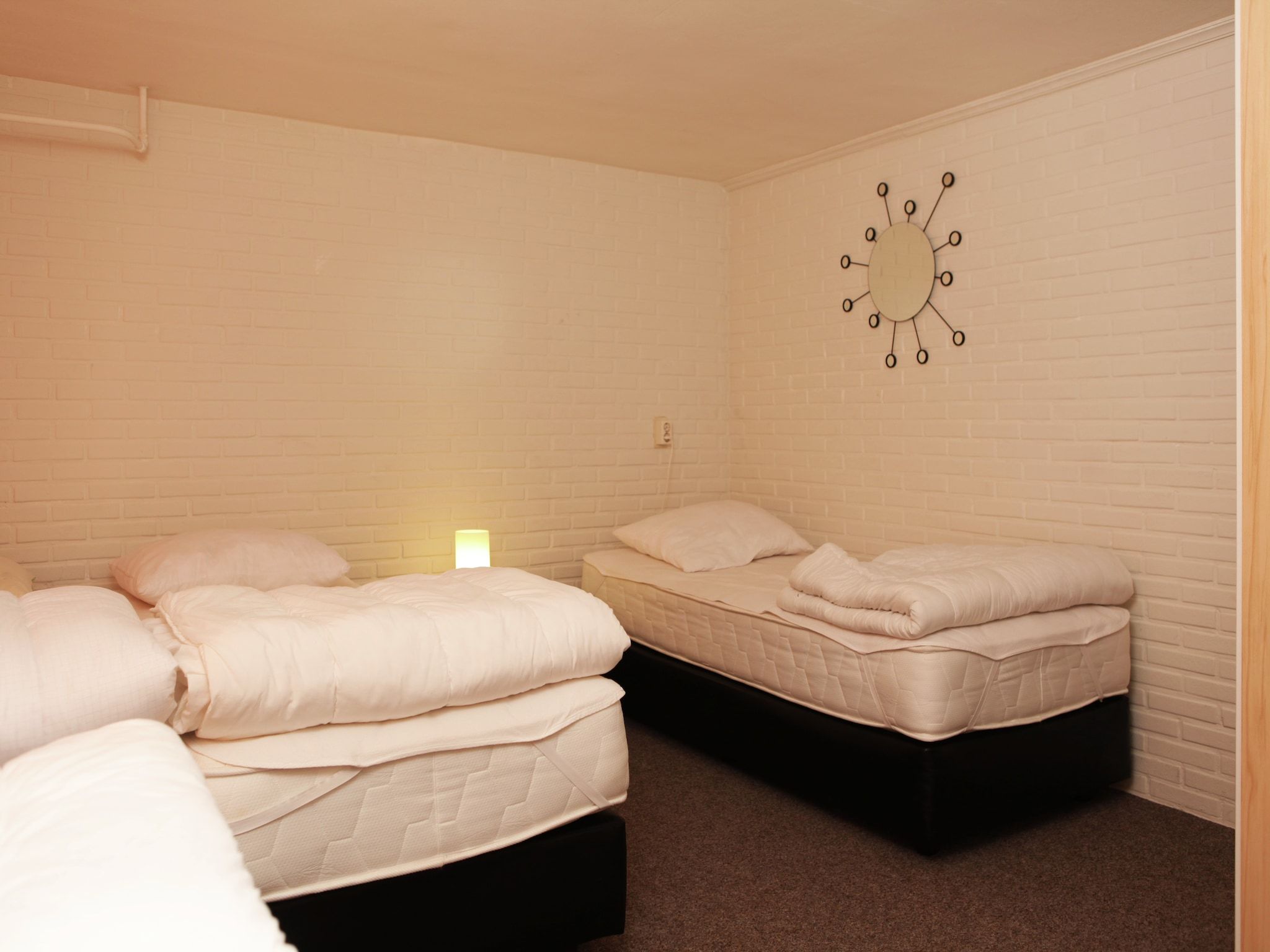 Een slaapkamer van De grove den in Doornspijk