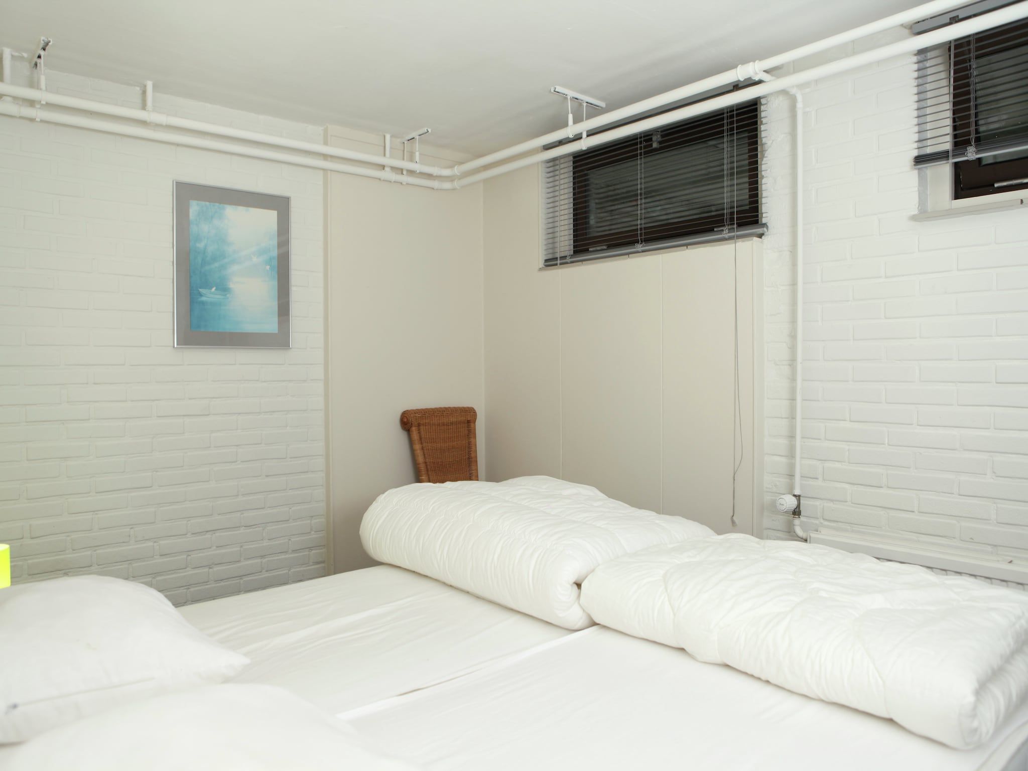 Een slaapkamer van De grove den in Doornspijk