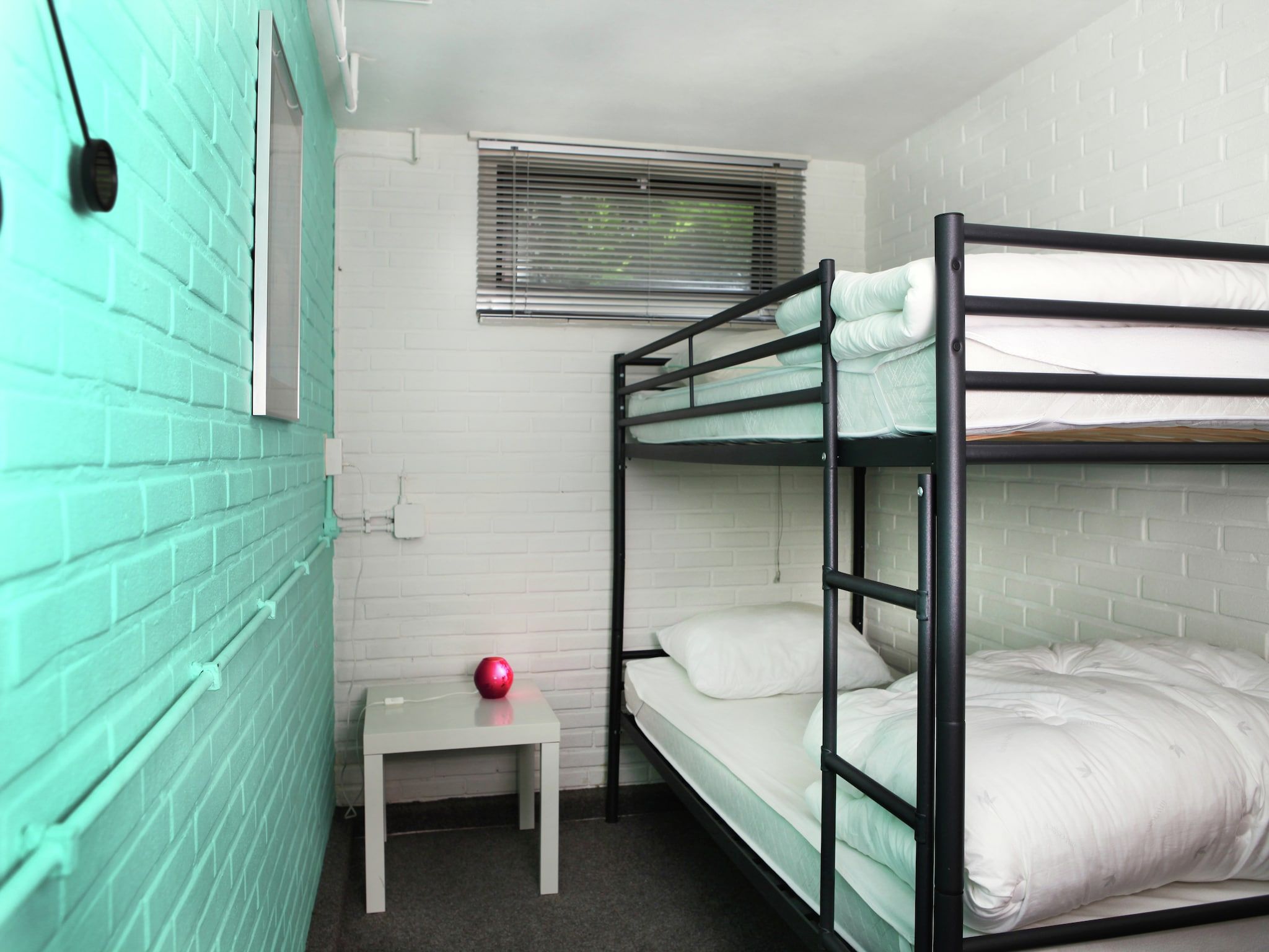 Een slaapkamer van De grove den in Doornspijk