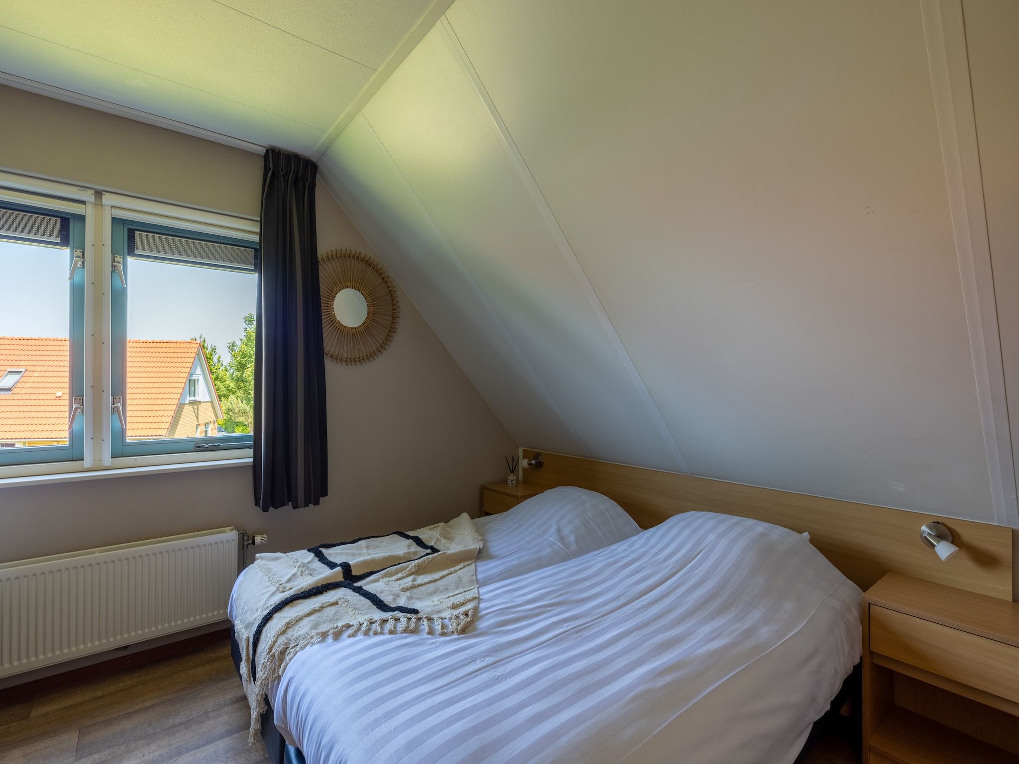 Een slaapkamer van Villavakantiepark IJsselhof 3 in Andijk