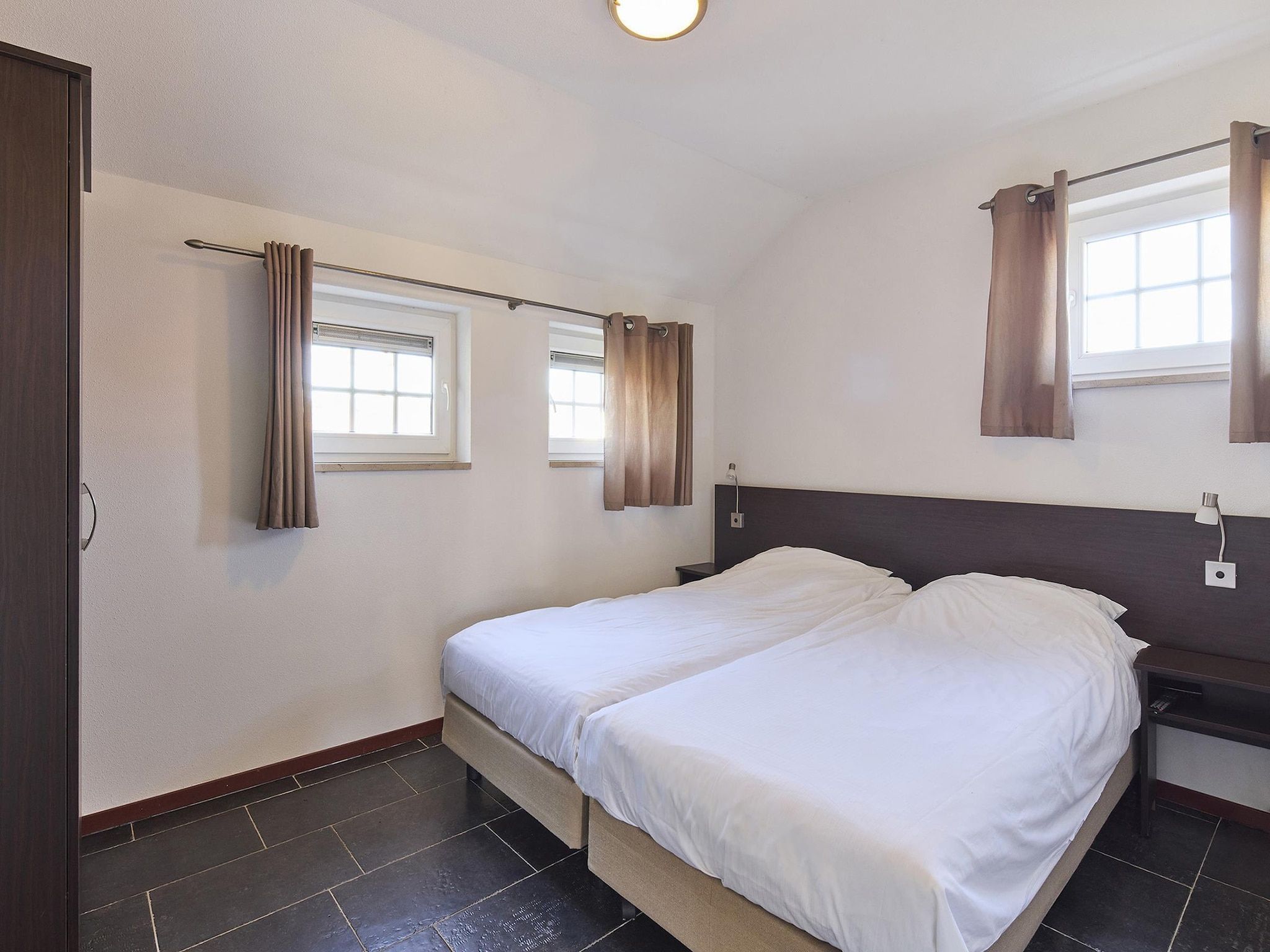 Een slaapkamer van Buitenhof De Leistert 7 in Roggel