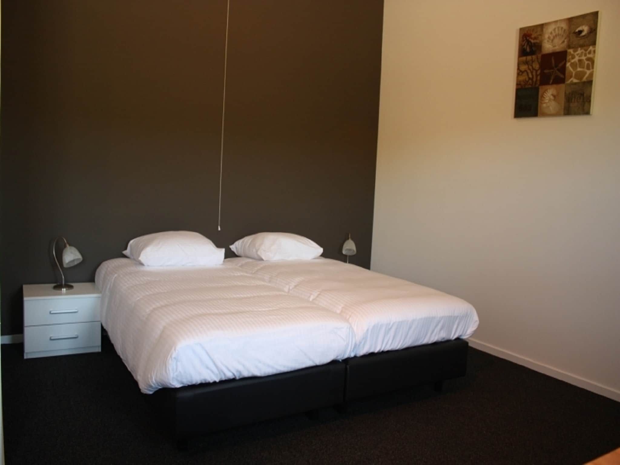 Een slaapkamer van Recreatiepark de Stelhoeve 2 in Wemeldinge