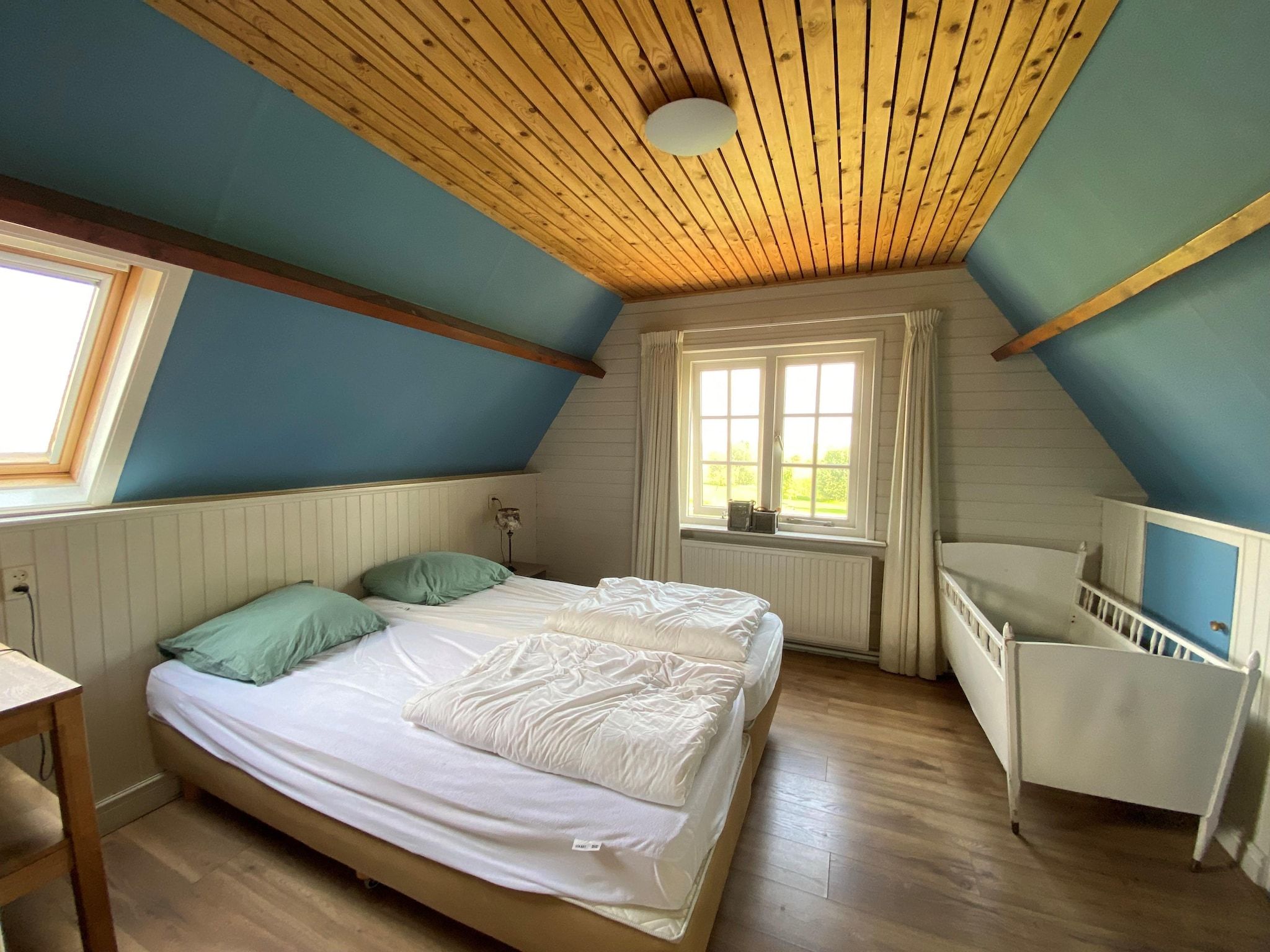 Een slaapkamer van Recreatiepark Wiringherlant - Ons Huys in Hippolytushoef