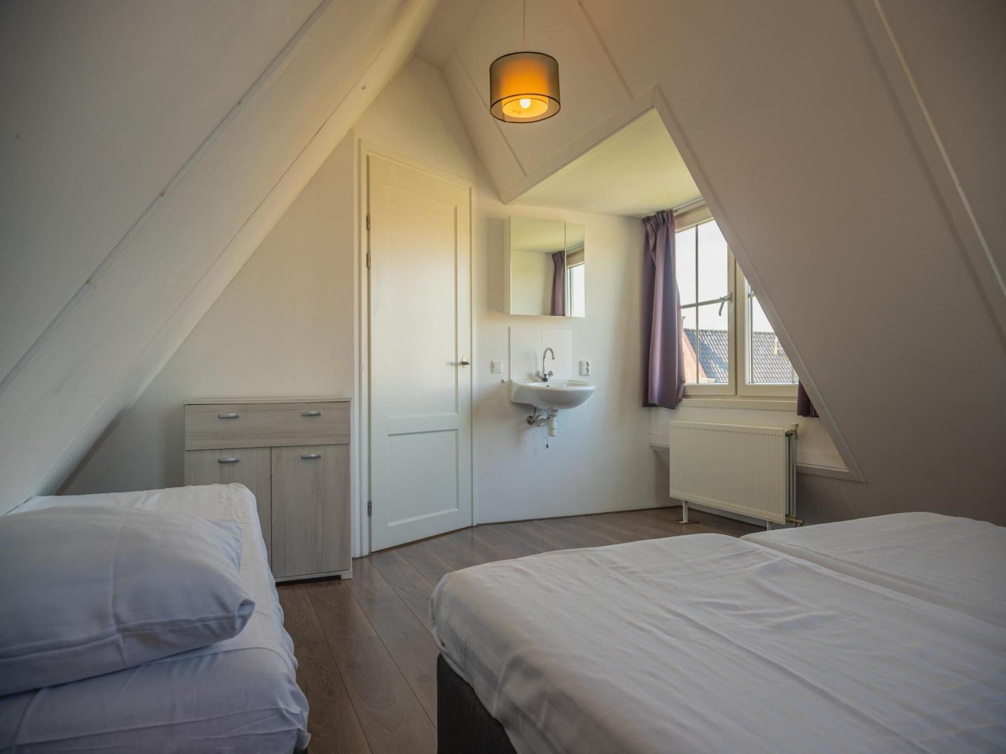 Een slaapkamer van 	Waterland  8 personen in West-Graftdijk