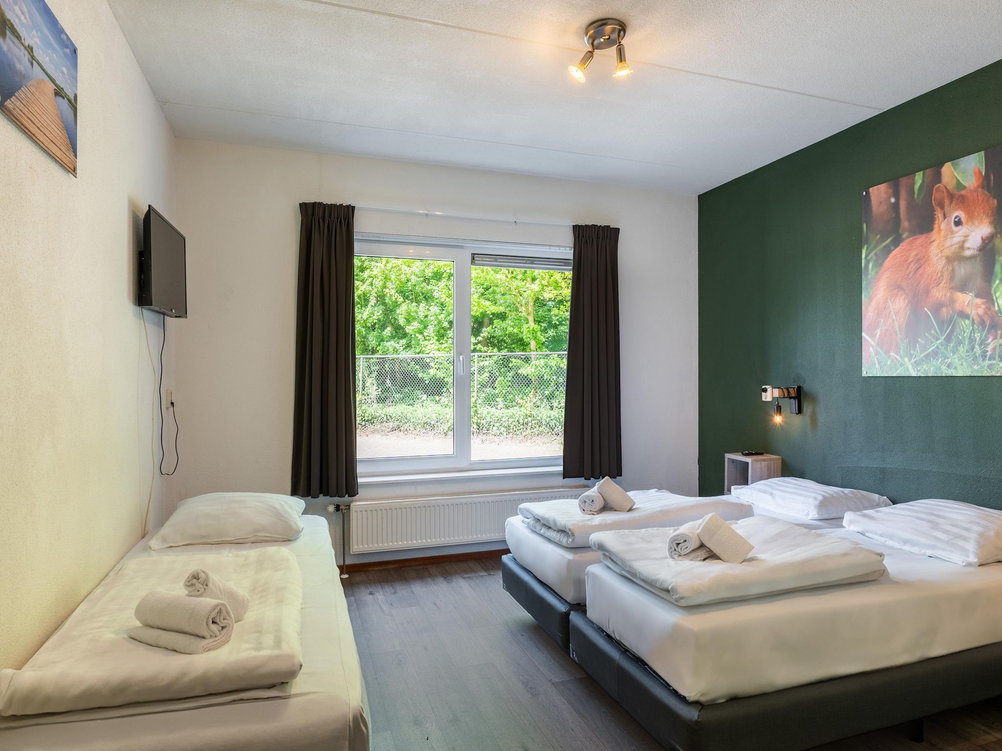 Een slaapkamer van Hunzepark 10 in Gasselternijveen