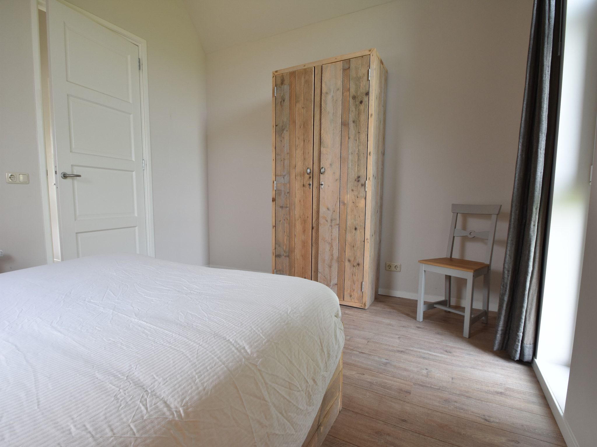 Een slaapkamer van Zeedijk III in Tzummarum