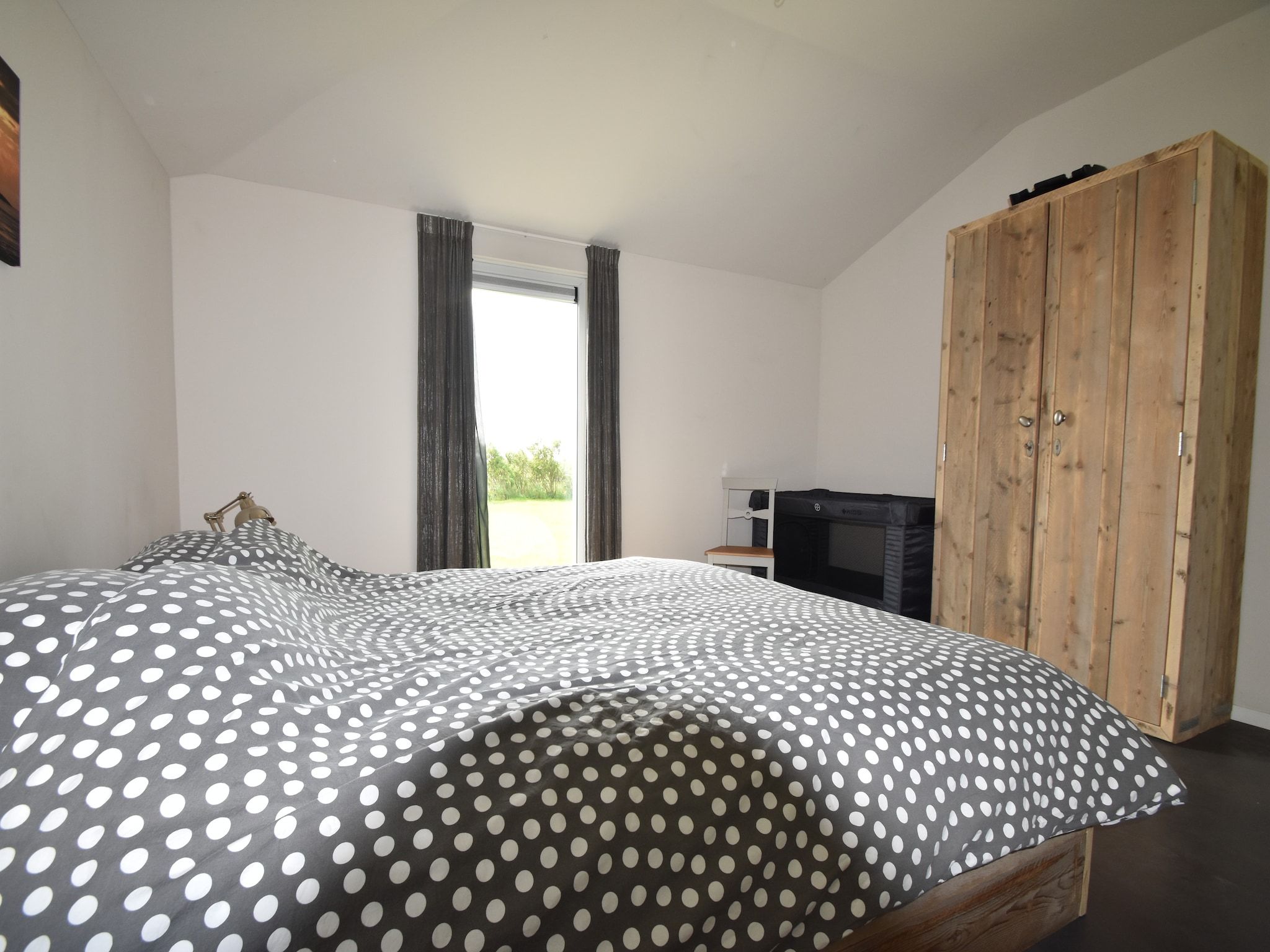 Een slaapkamer van Zeedijk III in Tzummarum