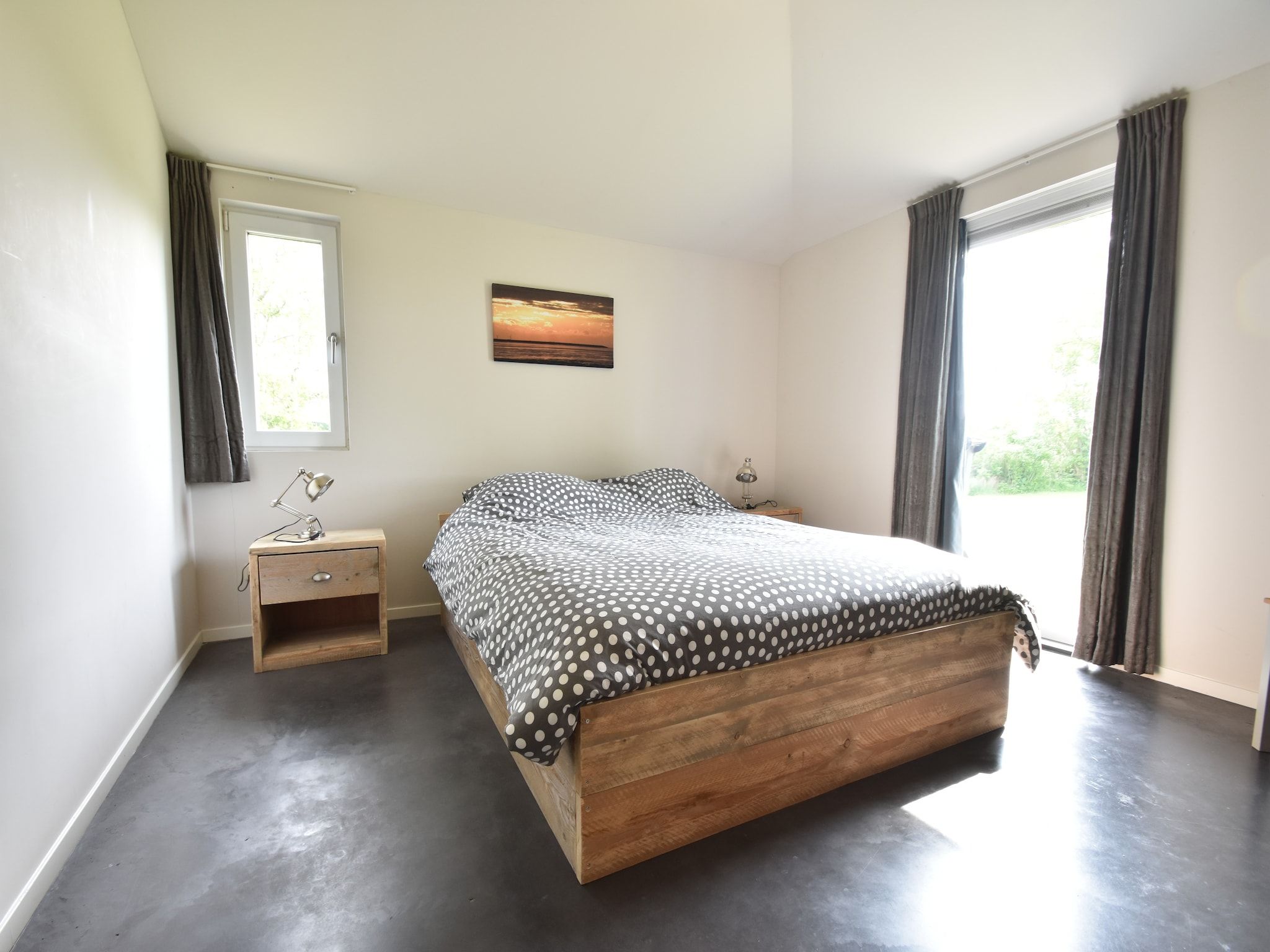 Een slaapkamer van Zeedijk III in Tzummarum