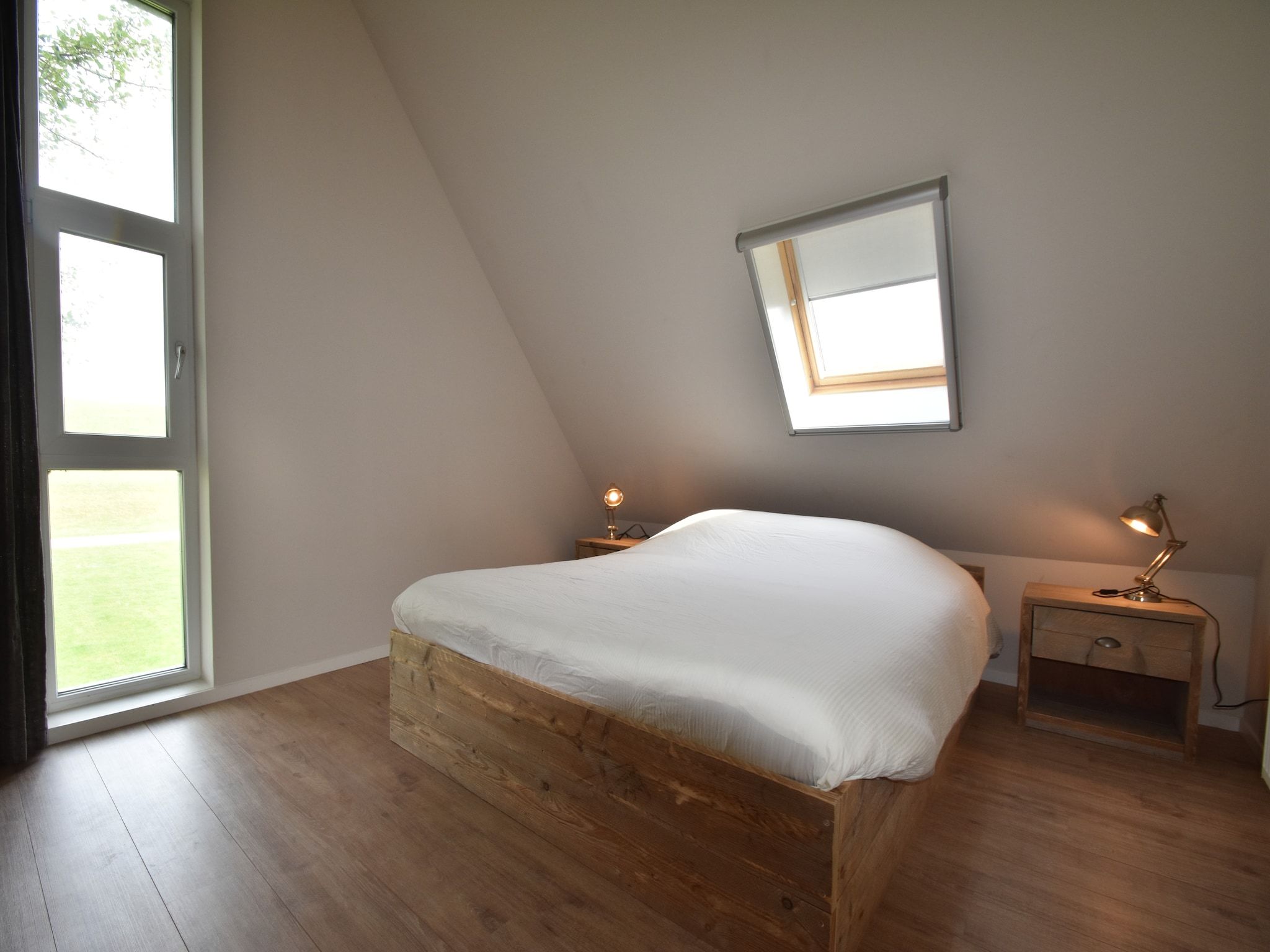 Een slaapkamer van Zeedijk III in Tzummarum