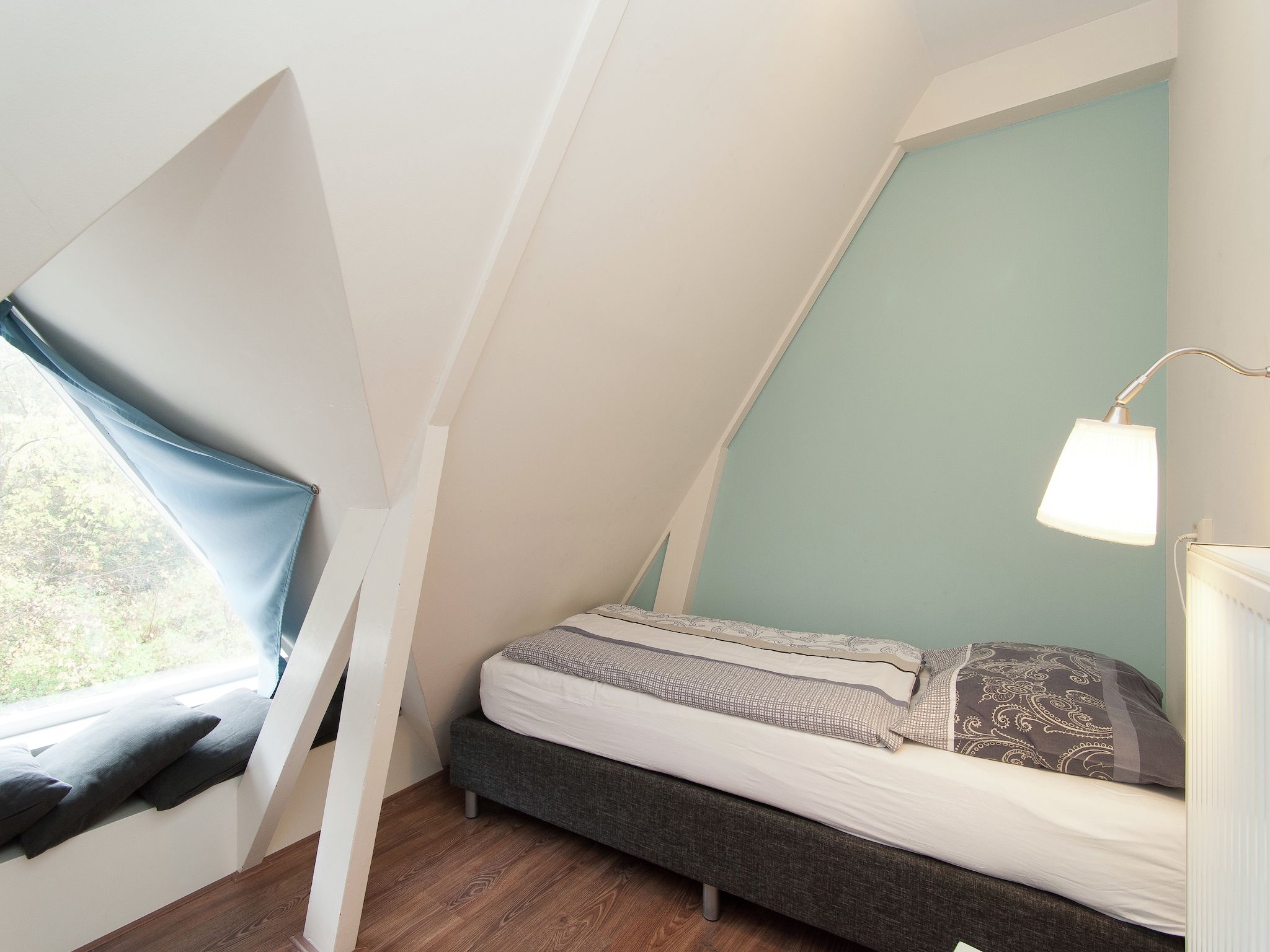 Een slaapkamer van Huize Glory Amethist aan Zee in Bergen aan zee