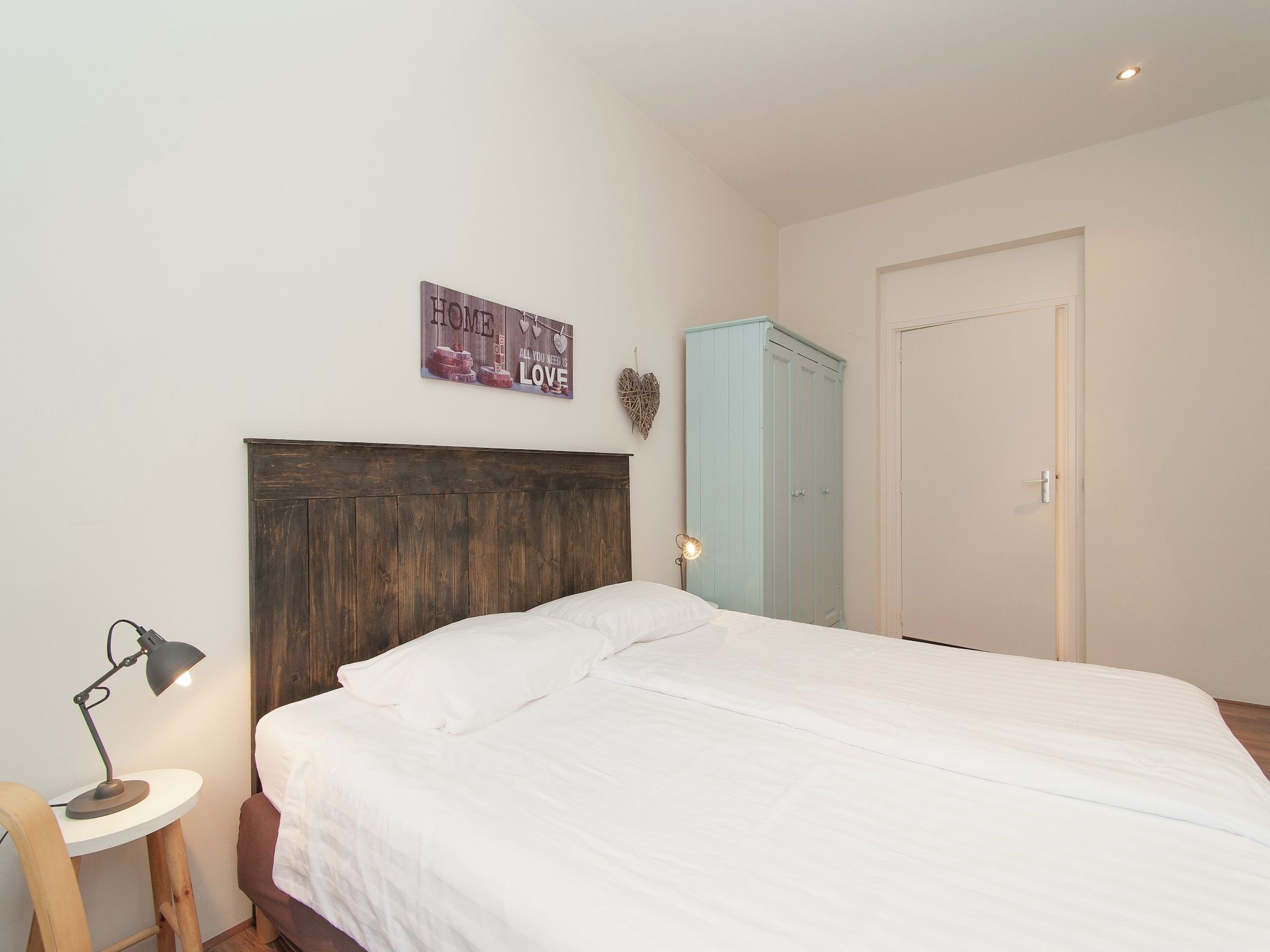 Een slaapkamer van Huize Glory Amethist aan Zee in Bergen aan zee