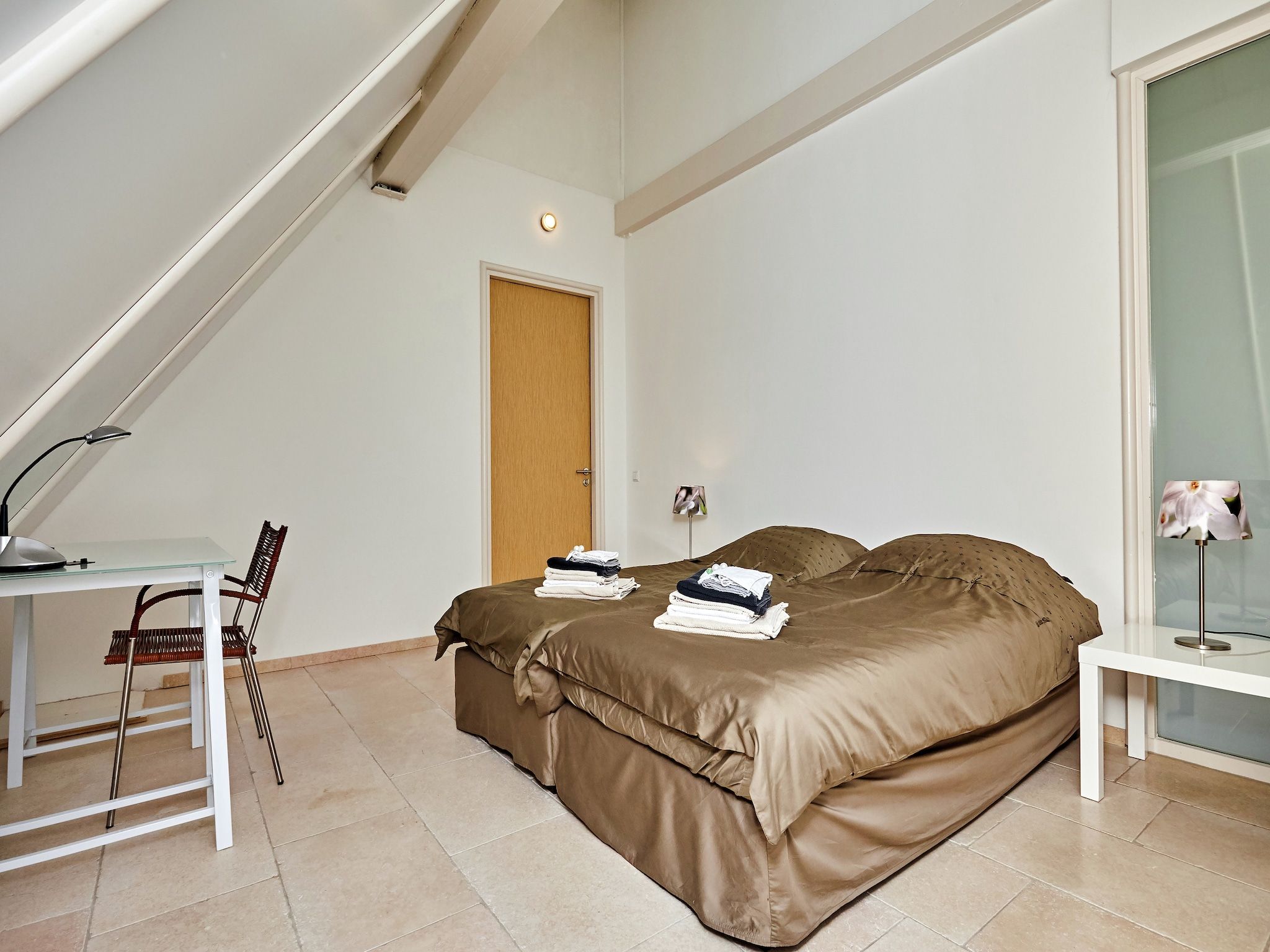 Een slaapkamer van Landhuis Wad Anders in Wierum