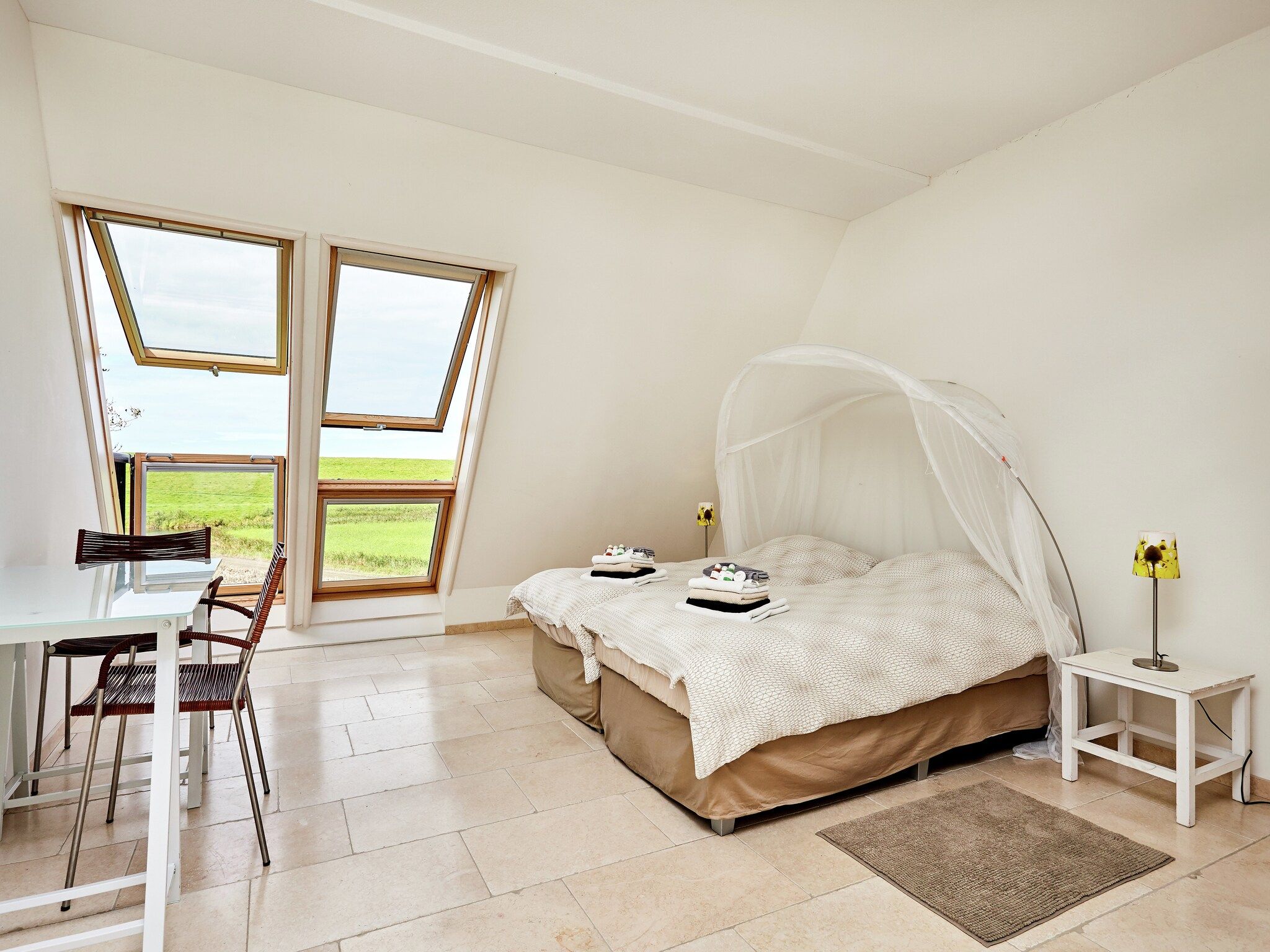 Een slaapkamer van Landhuis Wad Anders in Wierum