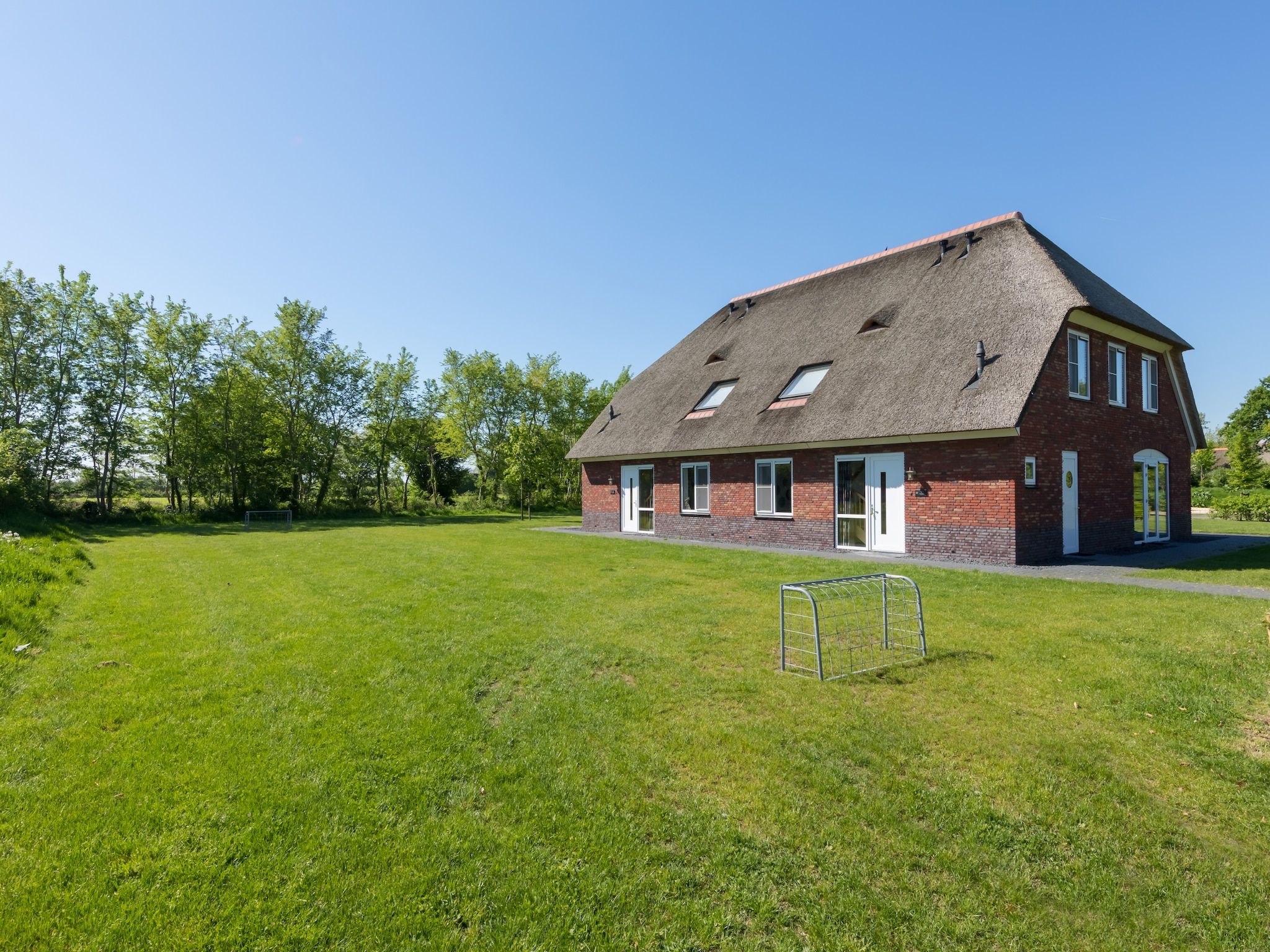De tuin van Résidence de Weerribben 3 in Paasloo