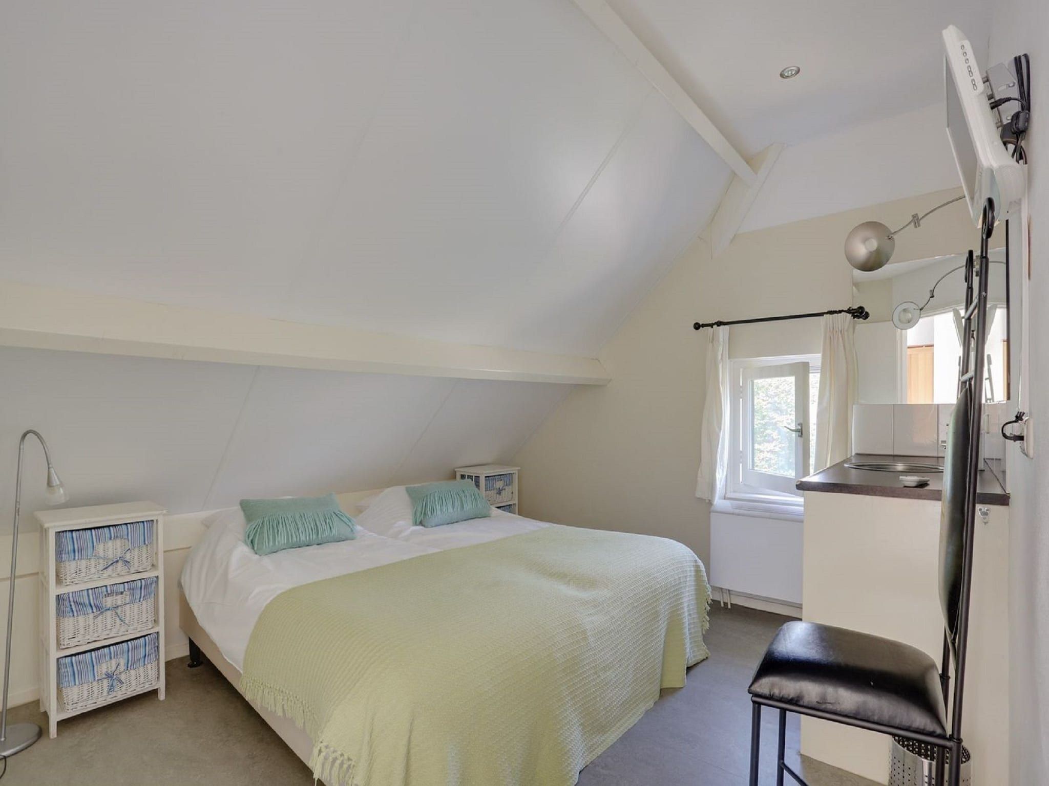 Een slaapkamer van Vakantiepark Sandberghe 2 in Uden