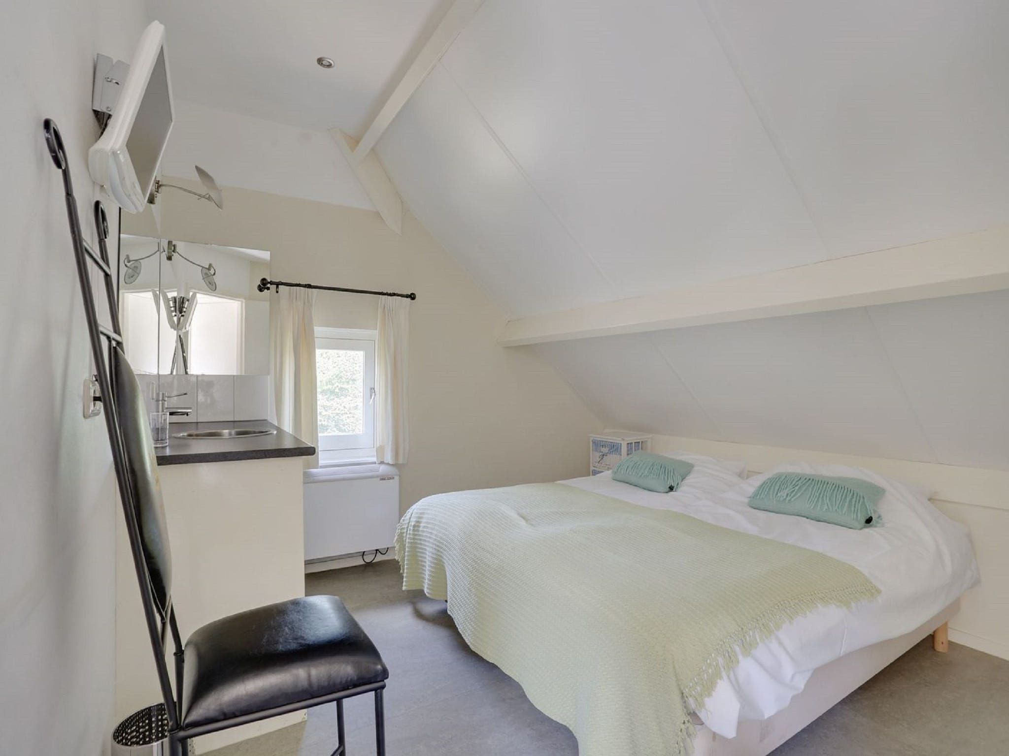 Een slaapkamer van Vakantiepark Sandberghe 2 in Uden