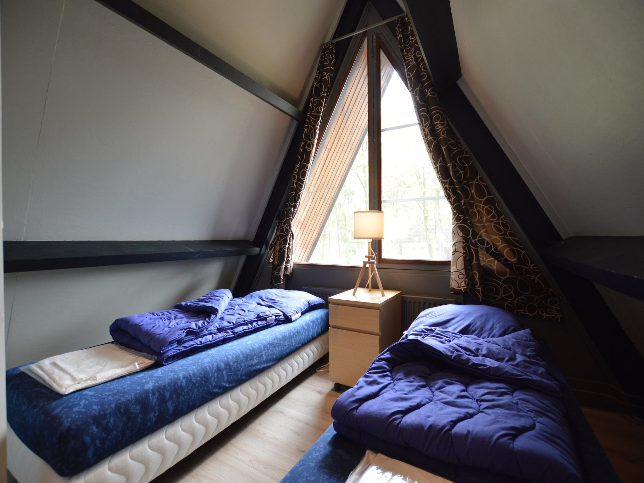 Een slaapkamer van Bungalows 48 en 49 in Stramproy