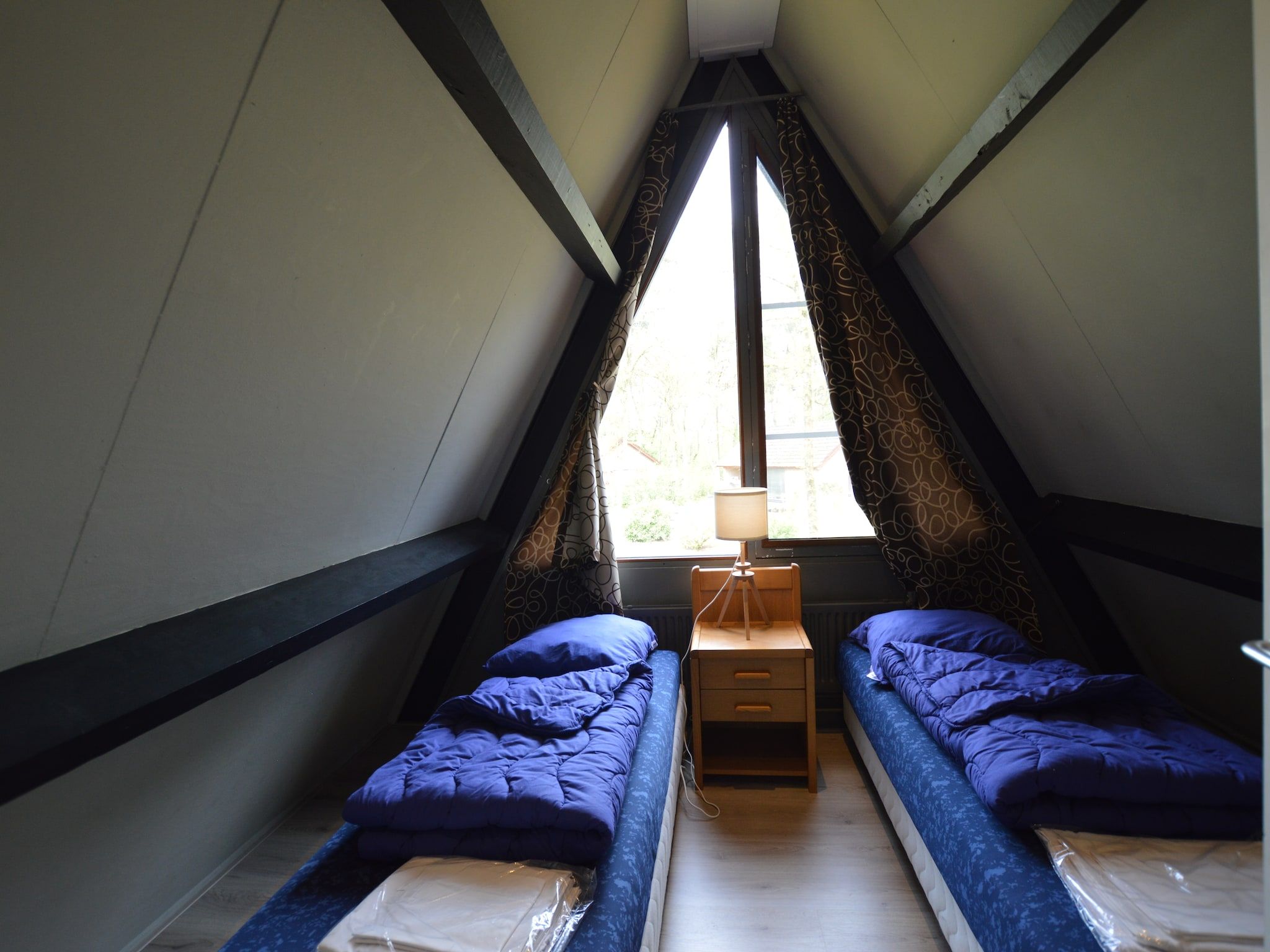 Een slaapkamer van Bungalows 48 en 49 in Stramproy