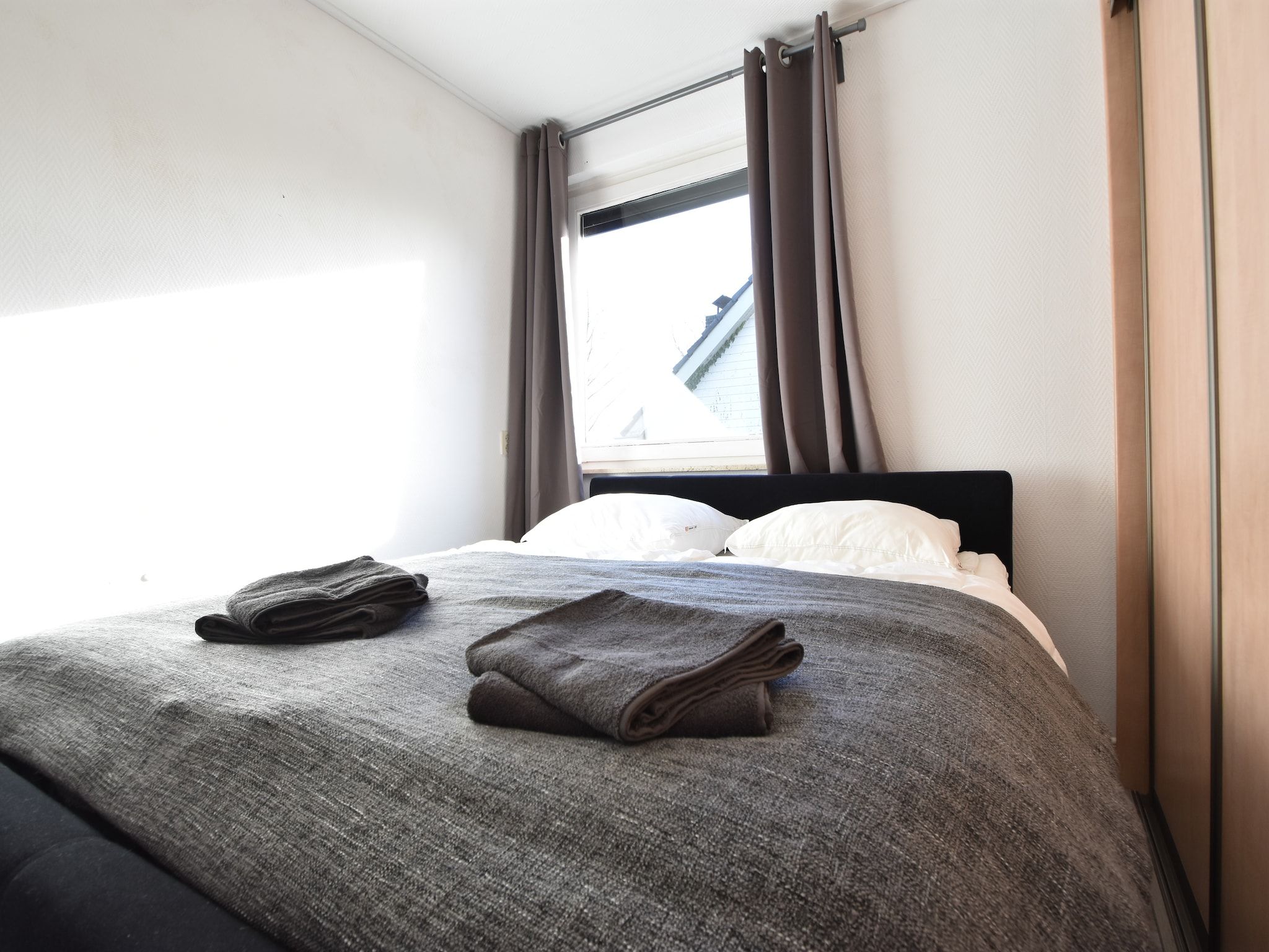 Een slaapkamer van Het Mosselhuys in Bruinisse