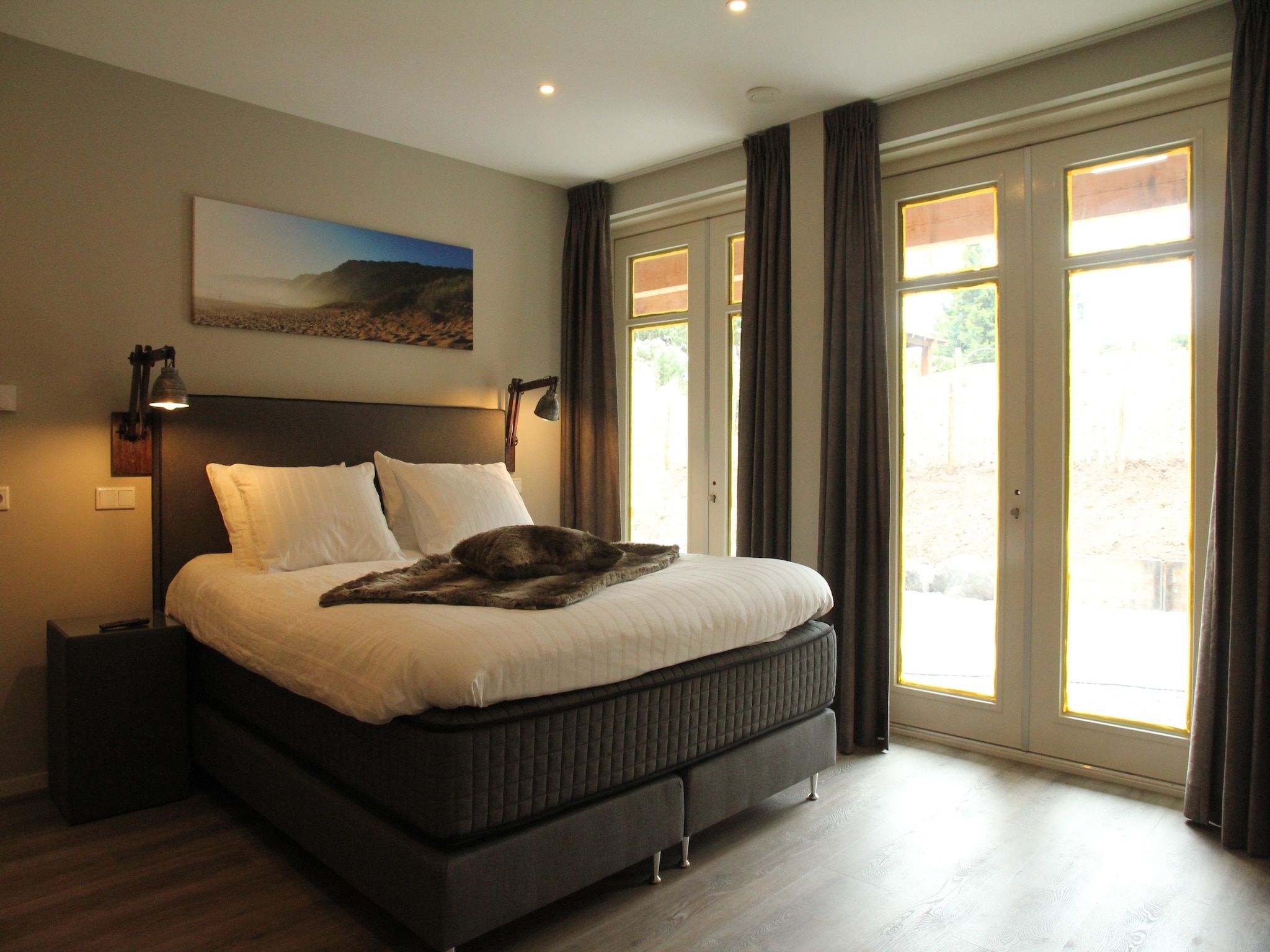 Een slaapkamer van Duinvilla Noordwijk in Noordwijk