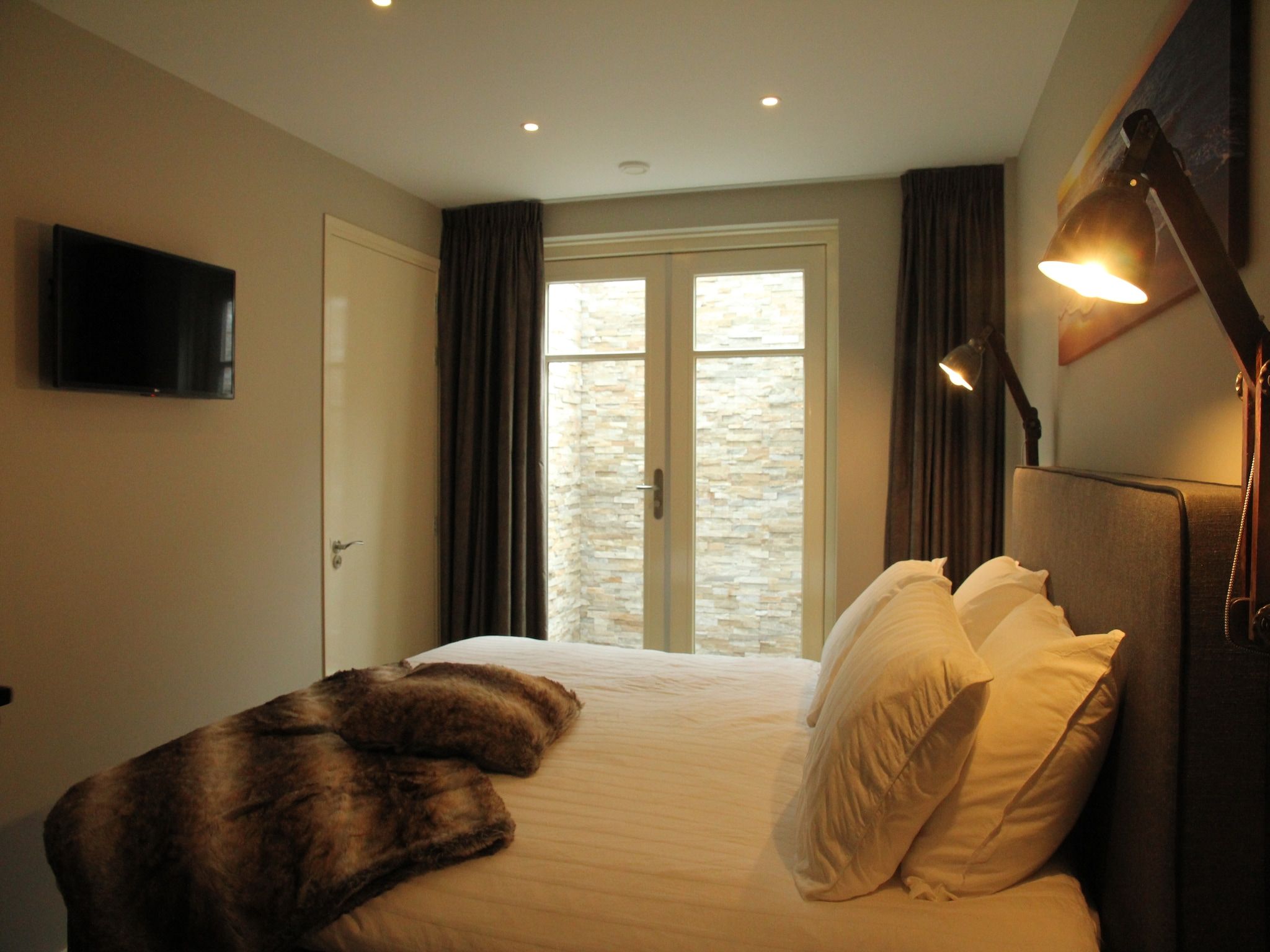 Een slaapkamer van Duinvilla Noordwijk in Noordwijk