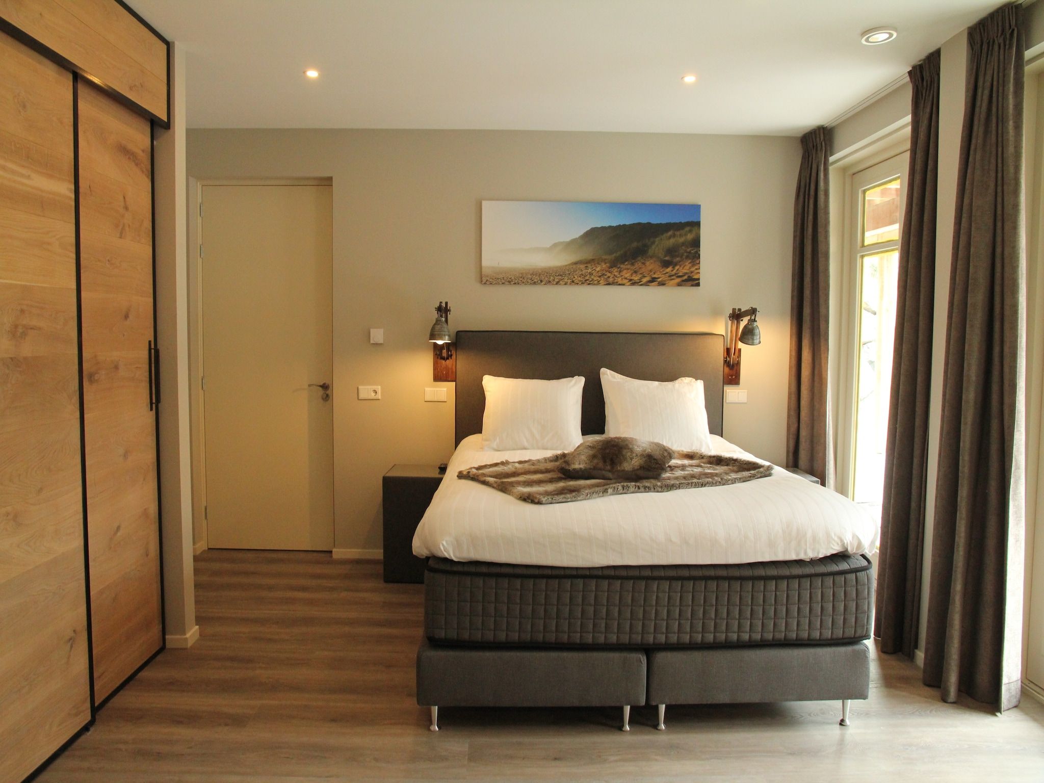 Een slaapkamer van Duinvilla Noordwijk in Noordwijk