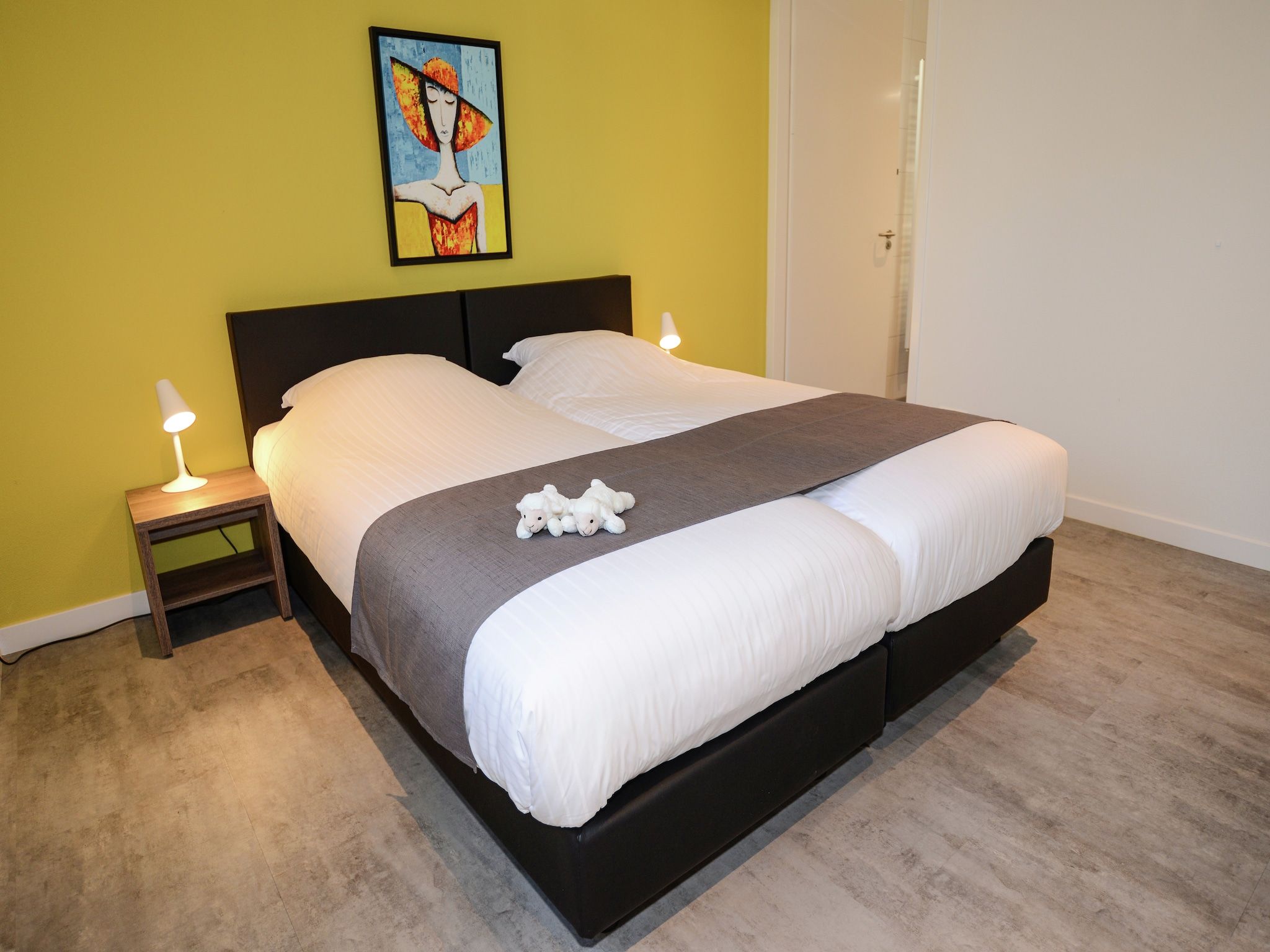 Een slaapkamer van Villa  Hoogeland 106L in De Koog-Texel