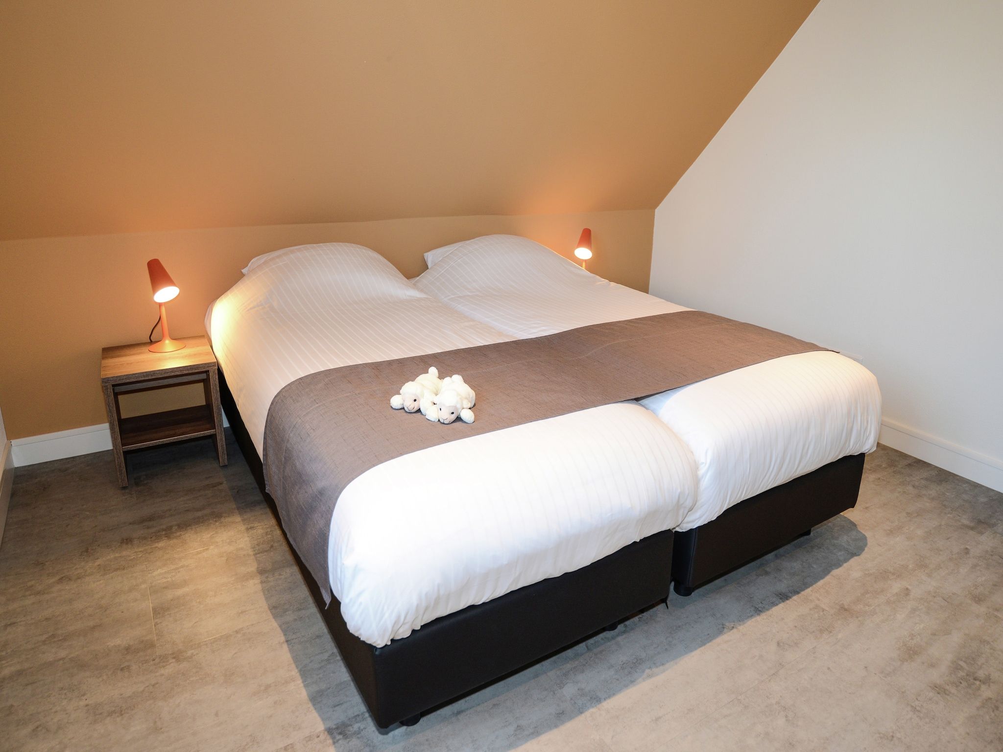 Een slaapkamer van Villa  Hoogeland 106L in De Koog-Texel