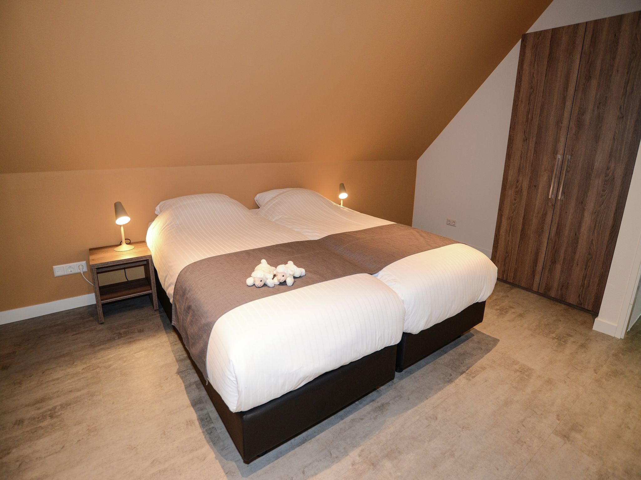 Een slaapkamer van Villa  Hoogeland 106L in De Koog-Texel