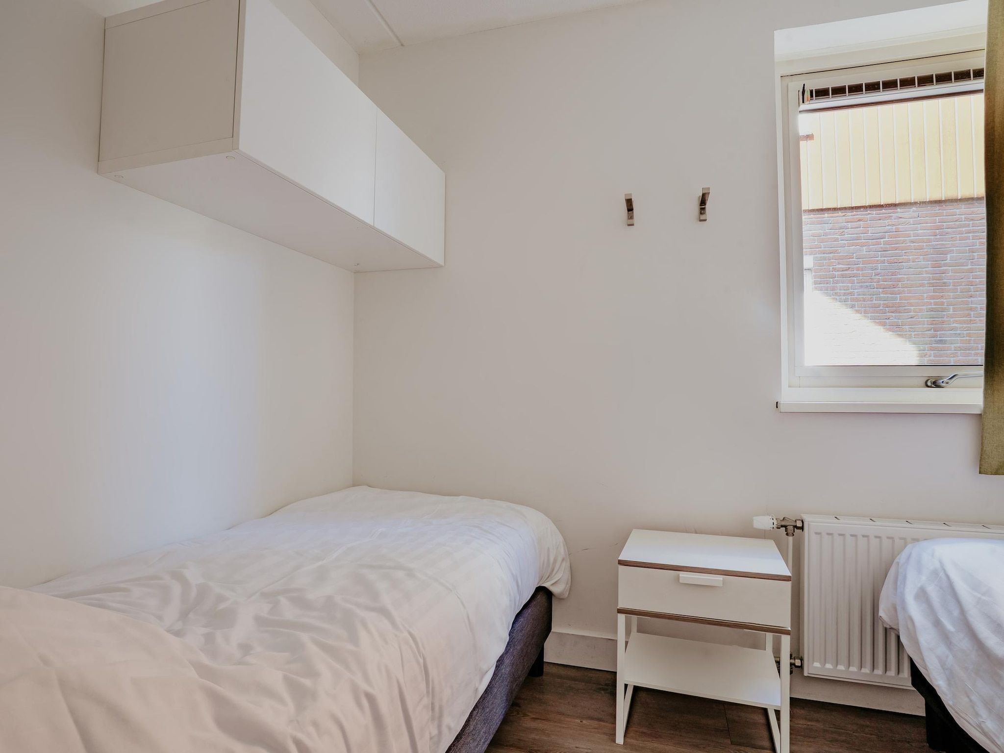 Een slaapkamer van Waterpark de Meerparel 8 in Uitgeest