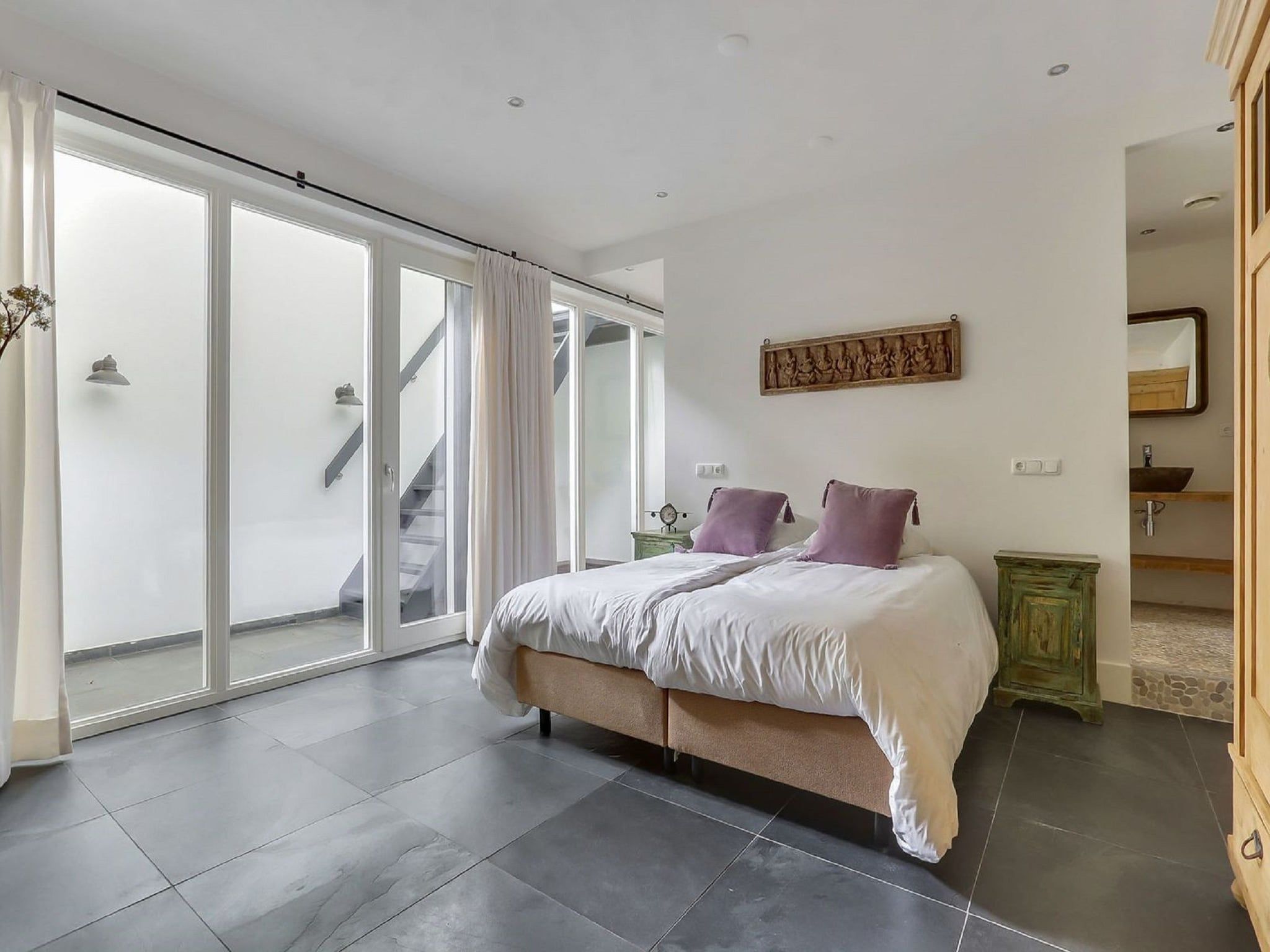 Een slaapkamer van Vakantiepark Sandberghe 7 in Uden