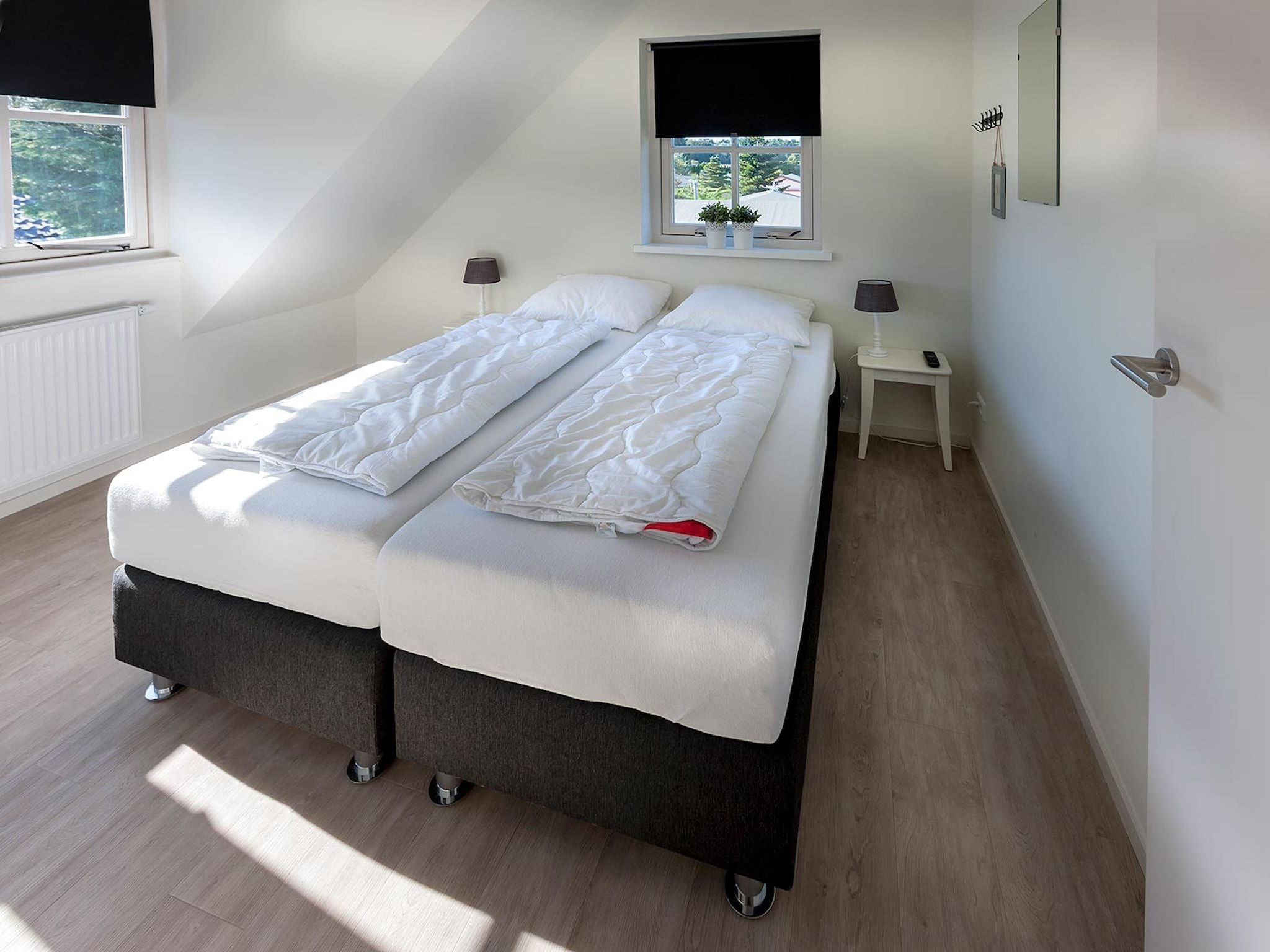 Een slaapkamer van Bungalowpark de Gouden Spar 5 in Noordwijk