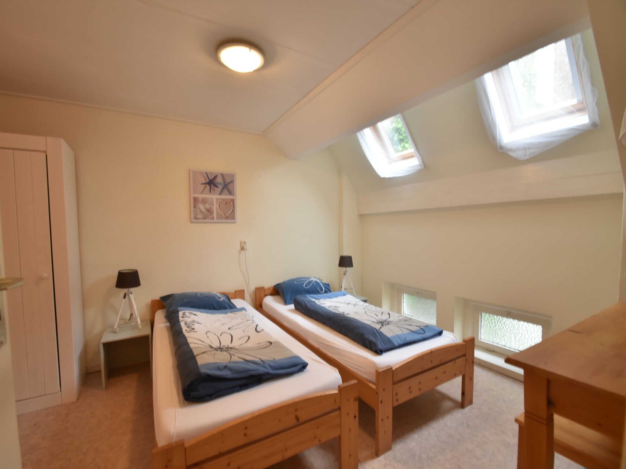 Een slaapkamer van Huize Glory Diamant in Bergen aan zee