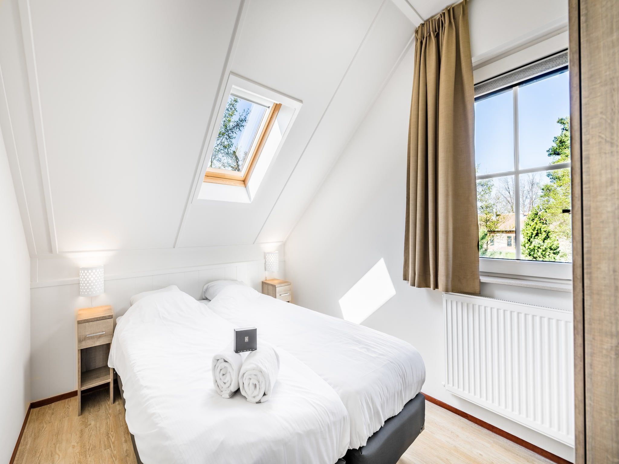 Een slaapkamer van Vakantiepark Weerterbergen 6 in Weert