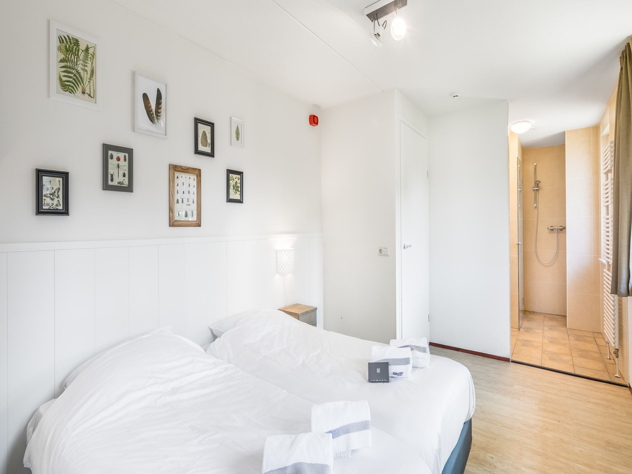 Een slaapkamer van Vakantiepark Weerterbergen 7 in Weert