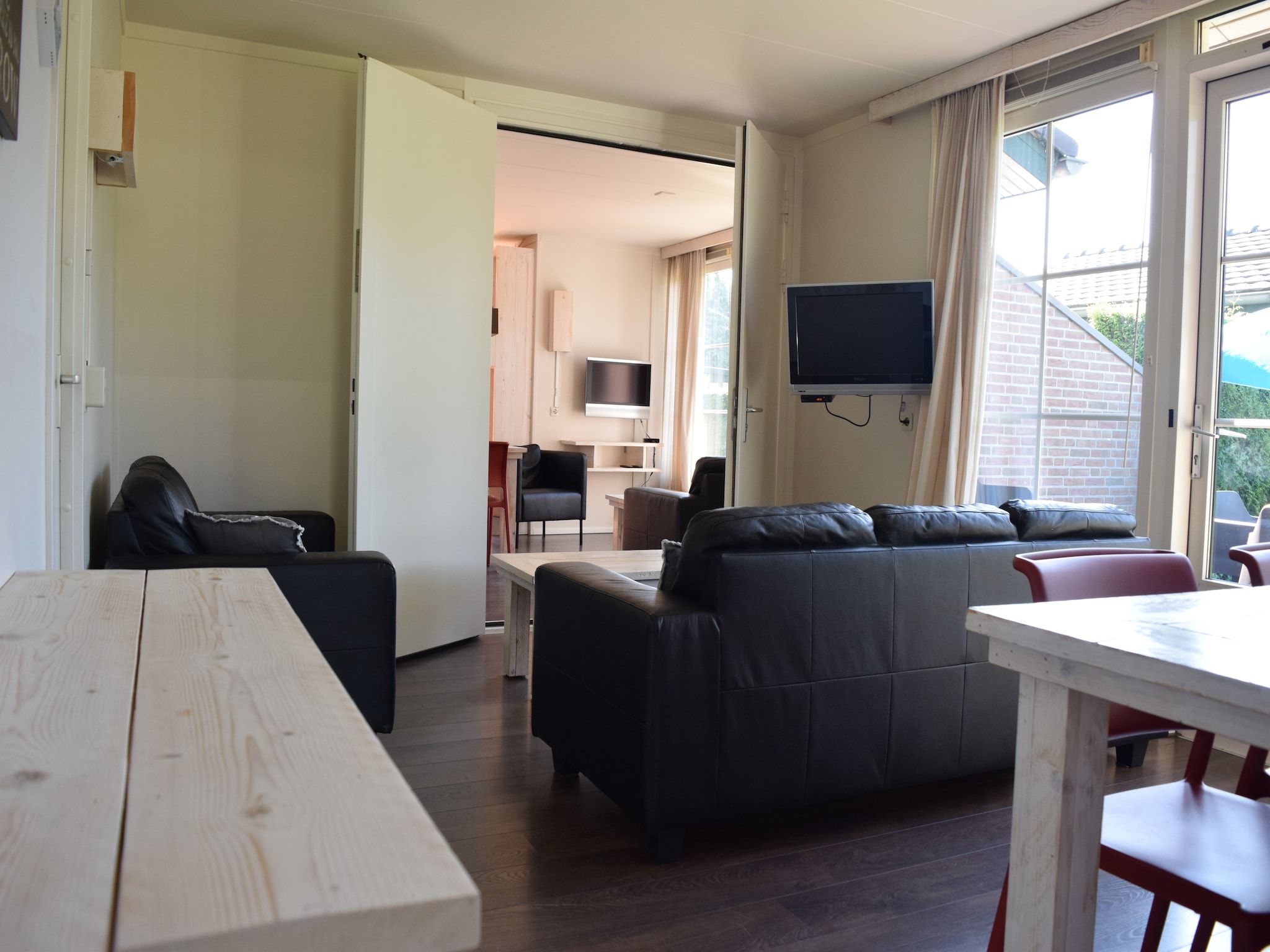 De woonkamer van Recreatiepark de Boshoek 13 in Voorthuizen