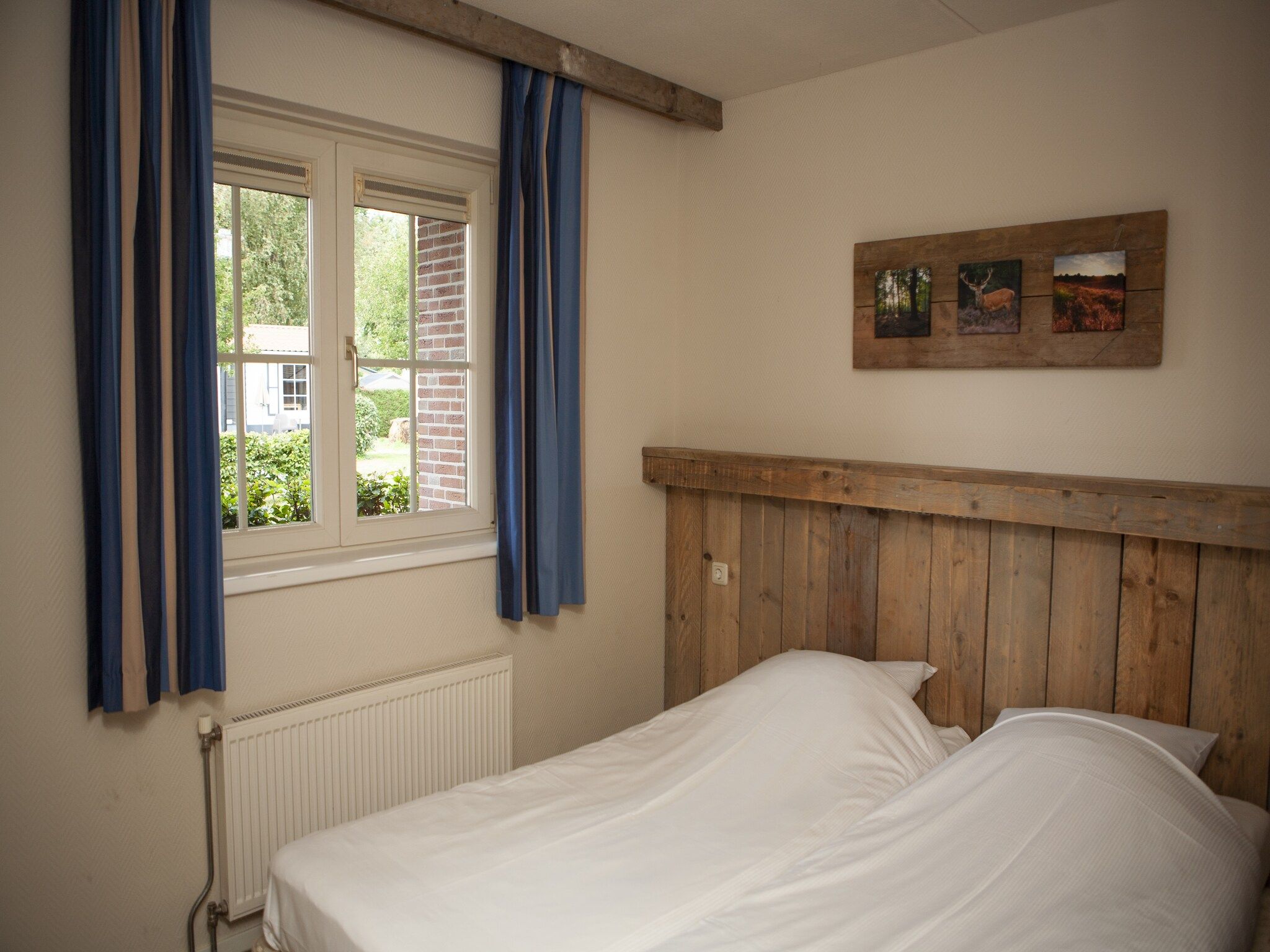 Een slaapkamer van Recreatiepark de Boshoek 14 in Voorthuizen