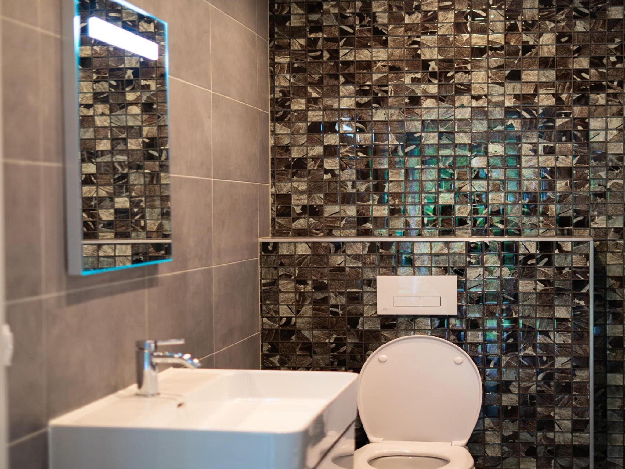 De badkamer van Vakantiepark De Rimboe & De Woeste Hoogte 3 in Hoenderloo