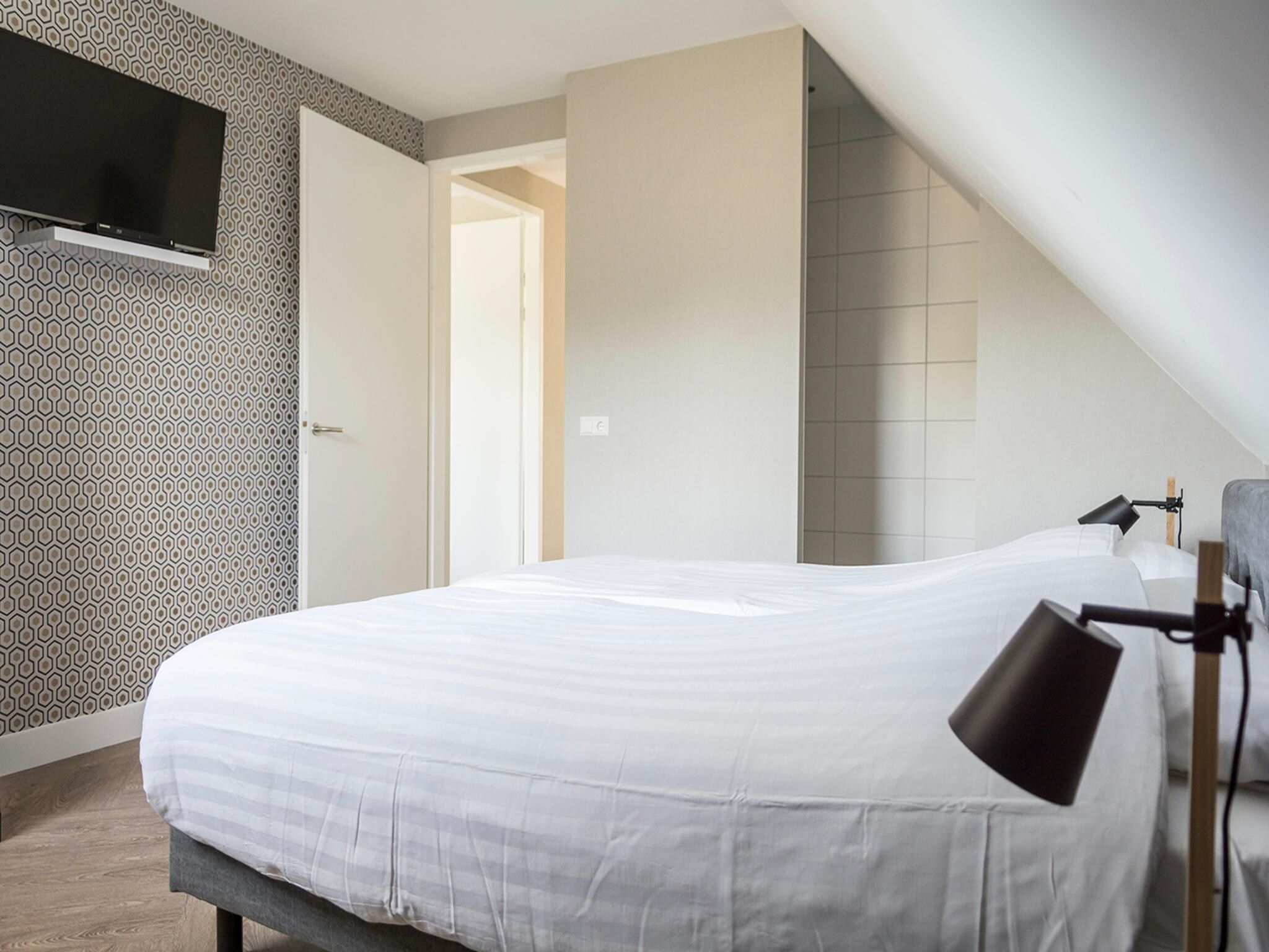 Een slaapkamer van Villa Bouwlust Z in De Cocksdorp Texel