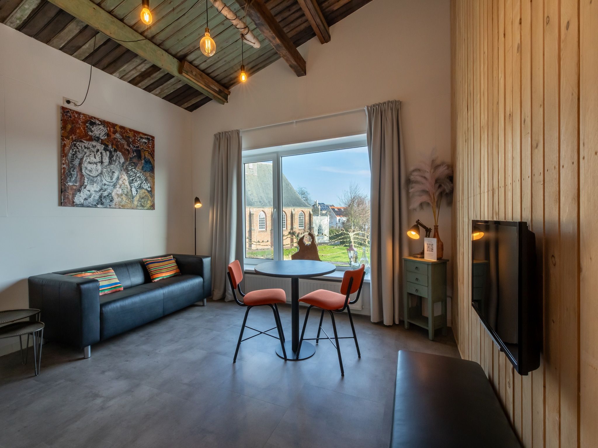 De woonkamer van Groepsappartement Pleinzicht in Koudekerke