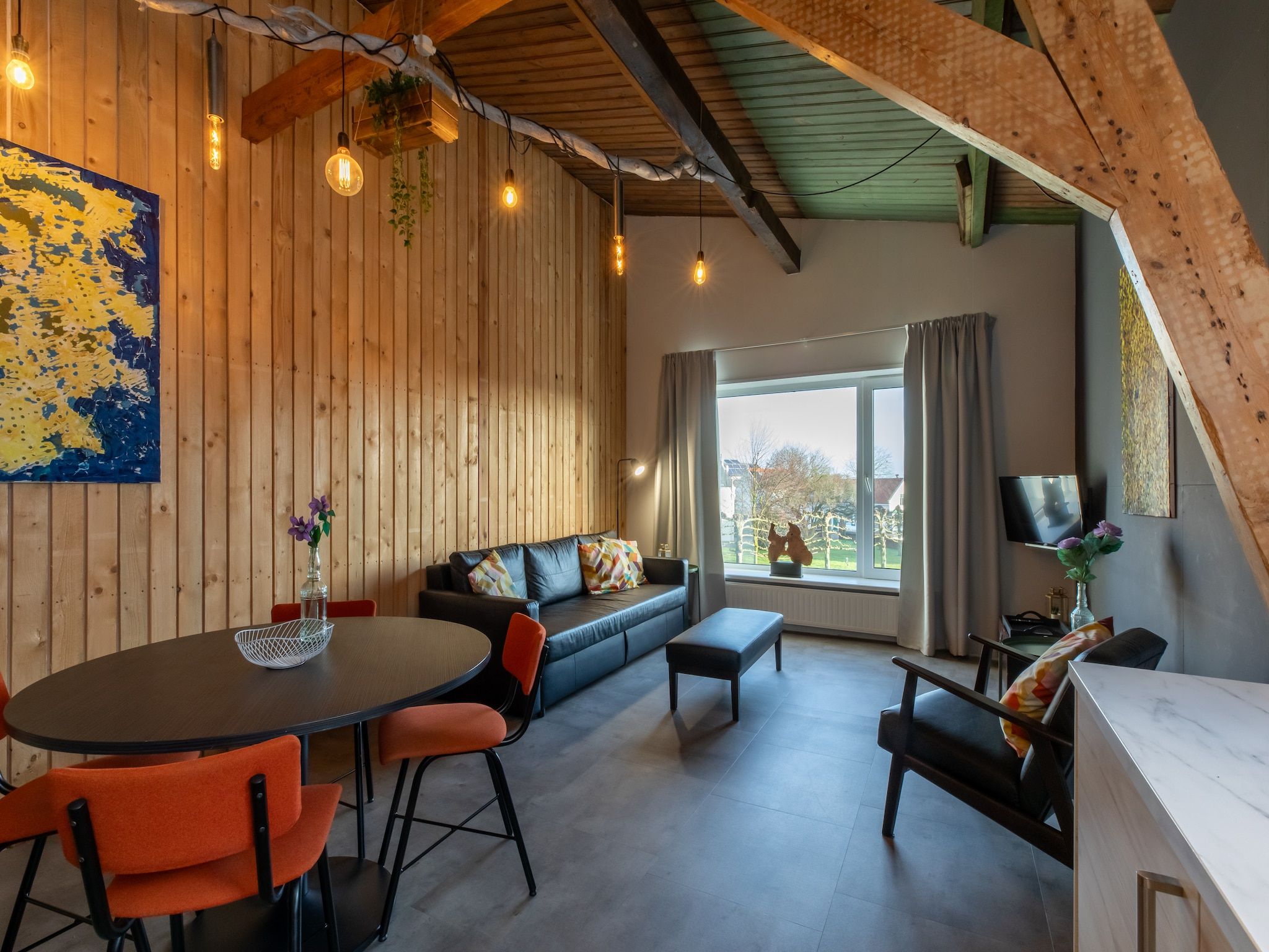 De woonkamer van Groepsappartement Pleinzicht in Koudekerke