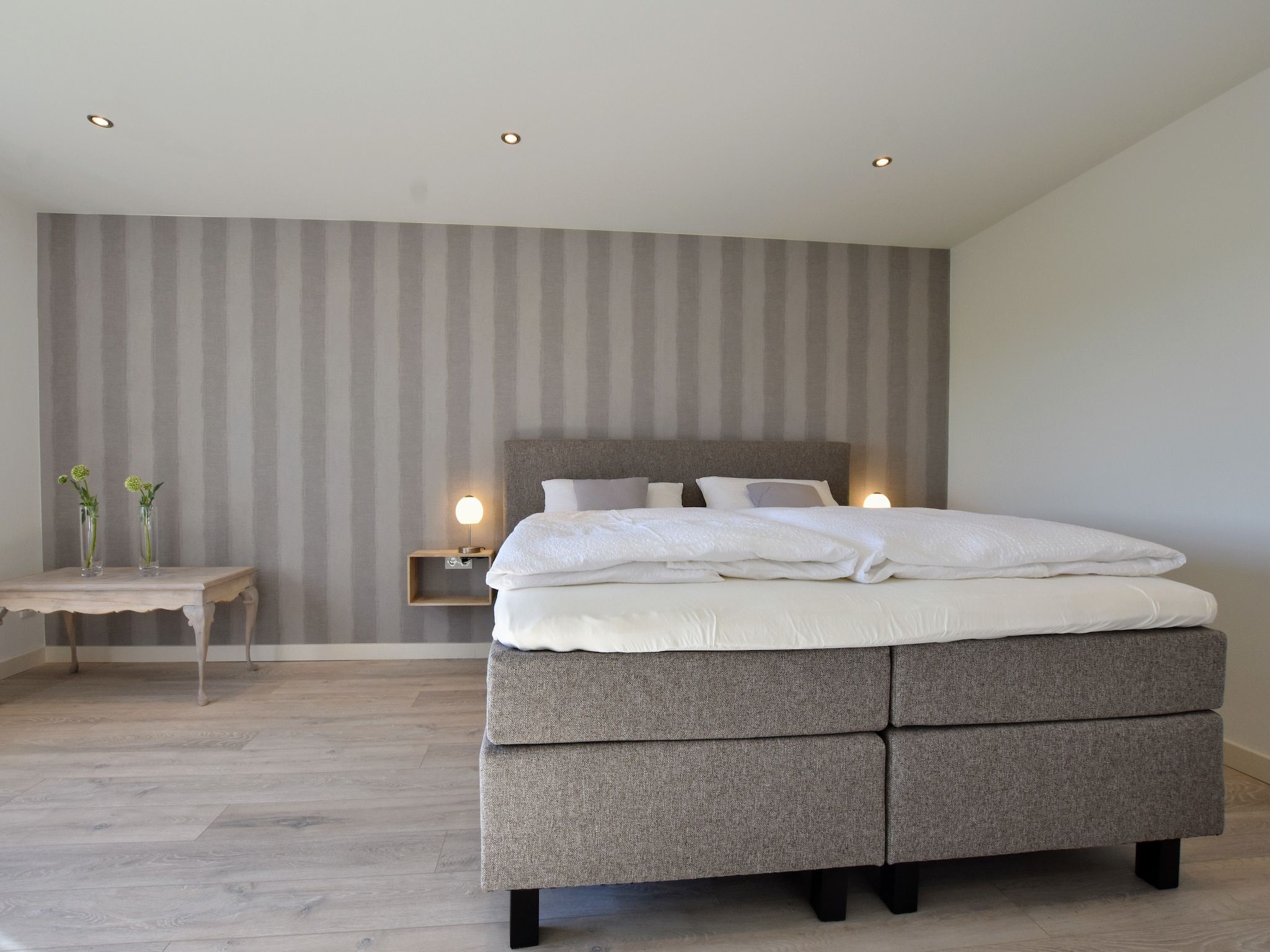 Een slaapkamer van Villa Grenszicht in Megchelen