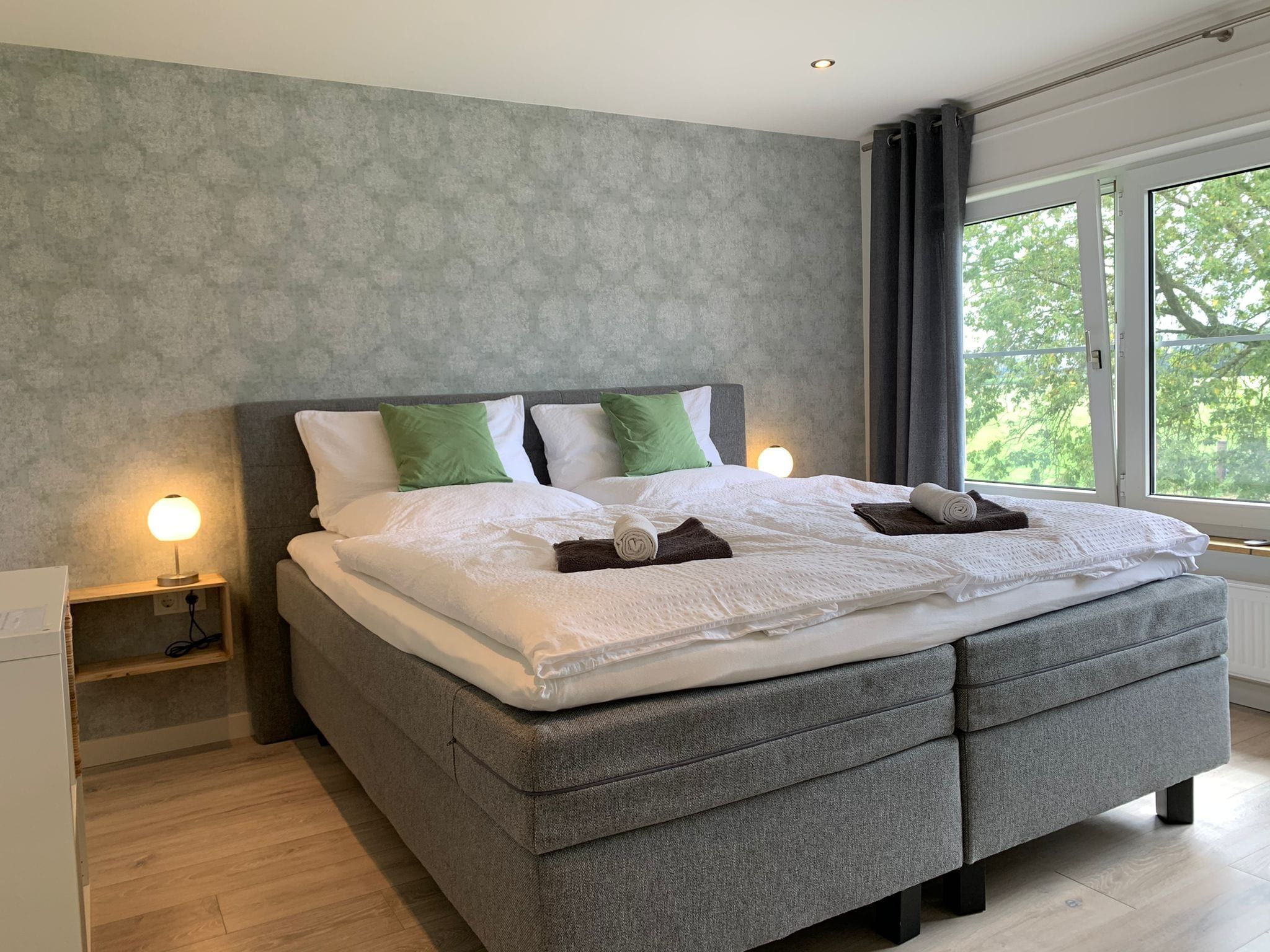 Een slaapkamer van Villa Grenszicht in Megchelen