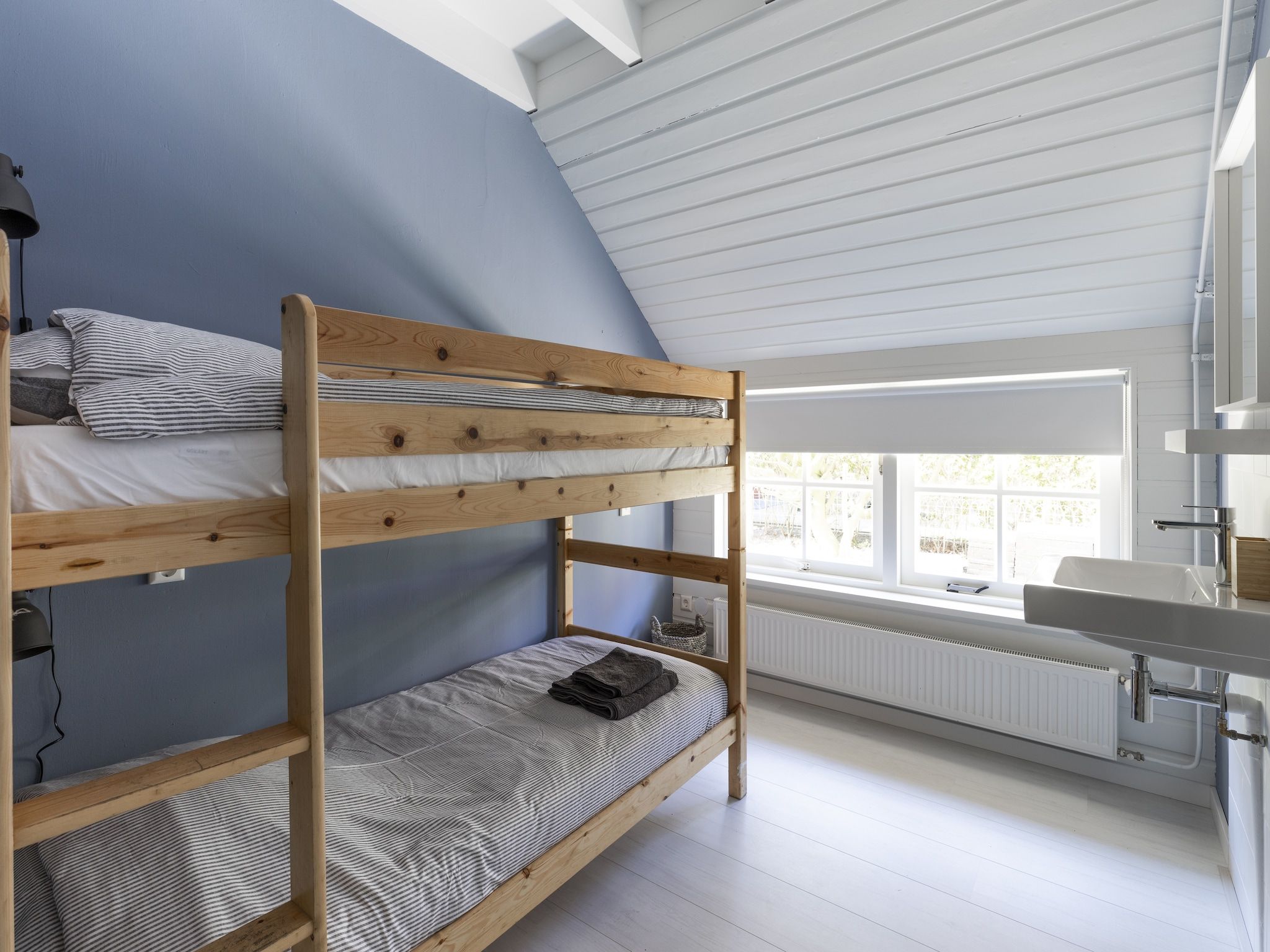 Een slaapkamer van De Groene Lantaarn in Groet (Schoorl)