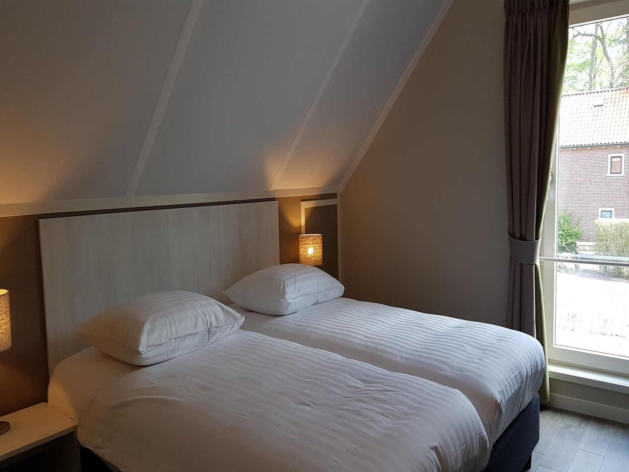 Een slaapkamer van Villapark Ehzerburg 2 in Almen