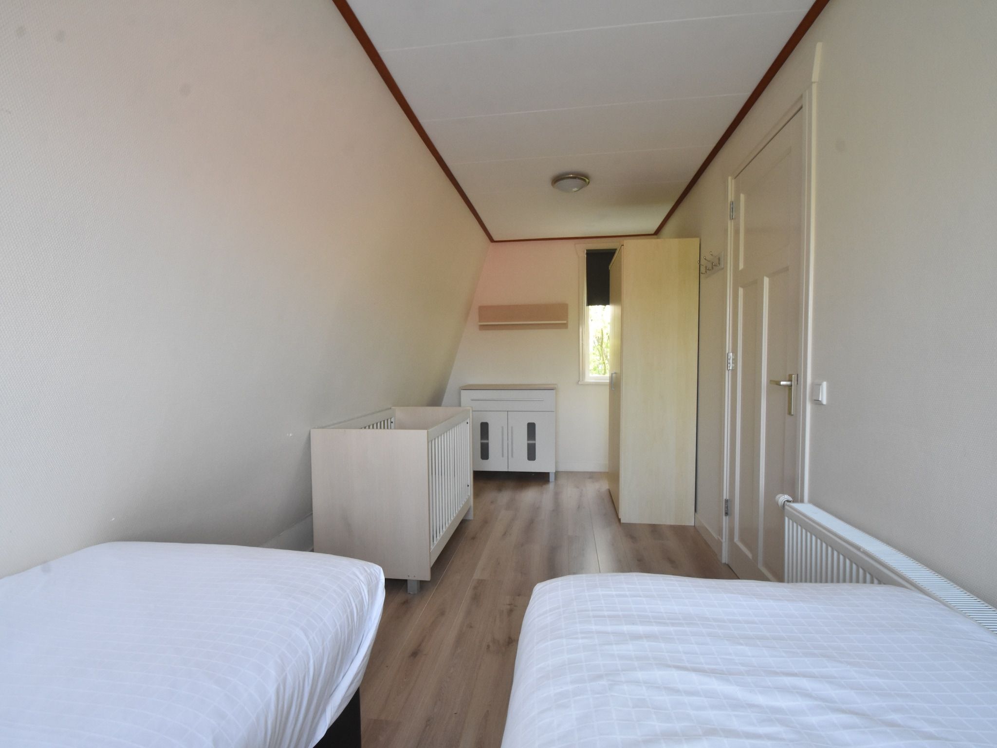 Een slaapkamer van 8p Garnekuul 1 in Callantsoog