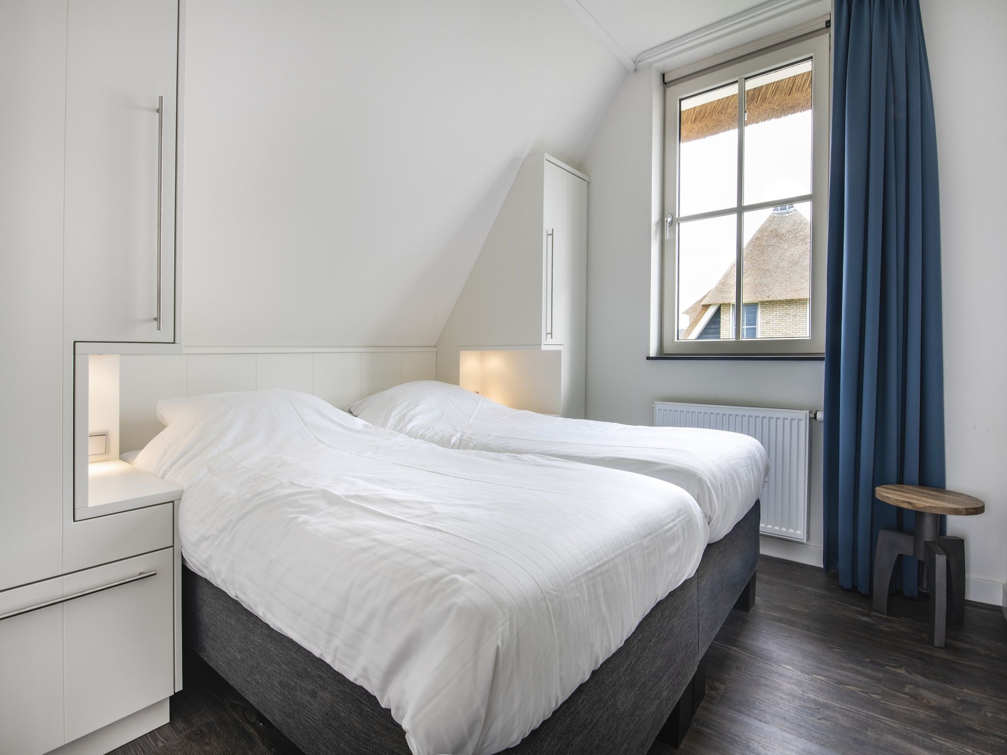 Een slaapkamer van Friese Meren Villa's 2 in Delfstrahuizen