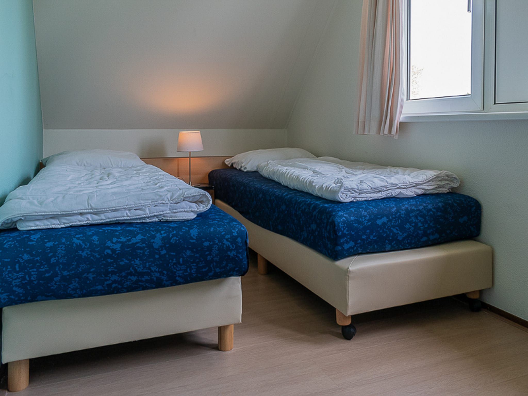 Een slaapkamer van Vakantiepark Emslandermeer 3 in Vlagtwedde