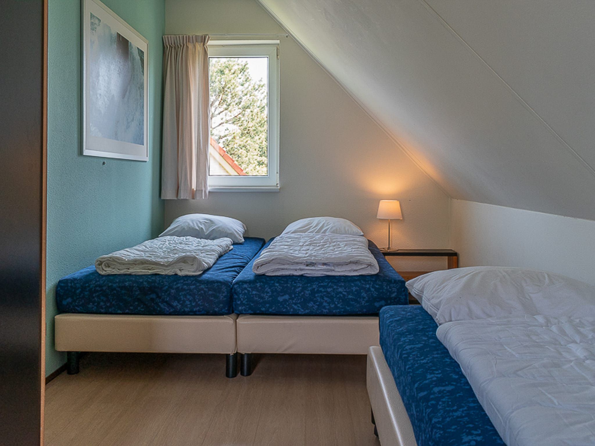 Een slaapkamer van Vakantiepark Emslandermeer 3 in Vlagtwedde