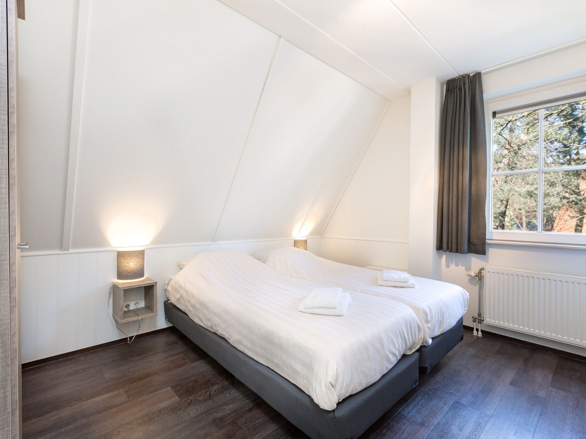 Een slaapkamer van Vakantiepark de Katjeskelder 12 in Oosterhout